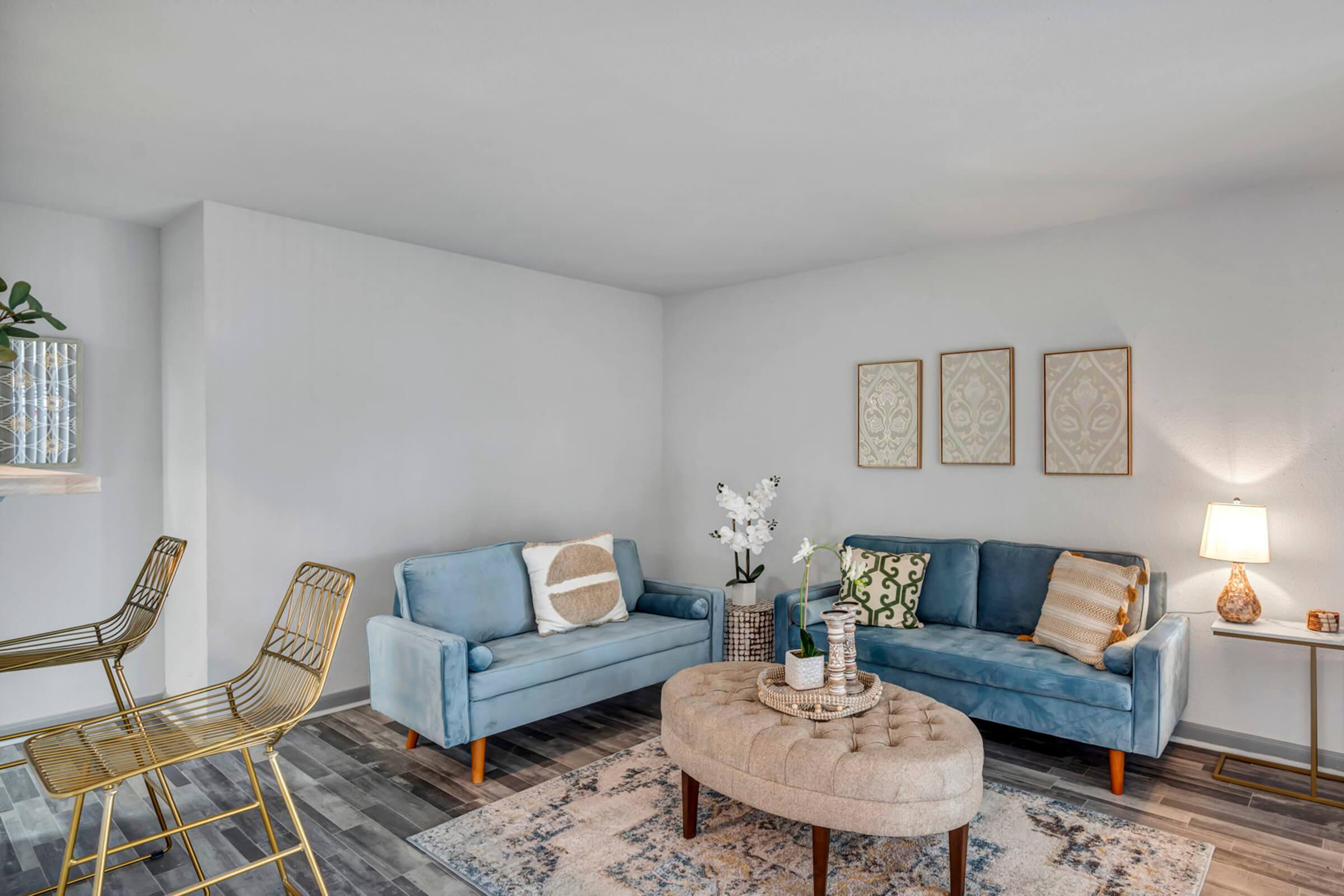 a living room filled with furniture and a fireplace