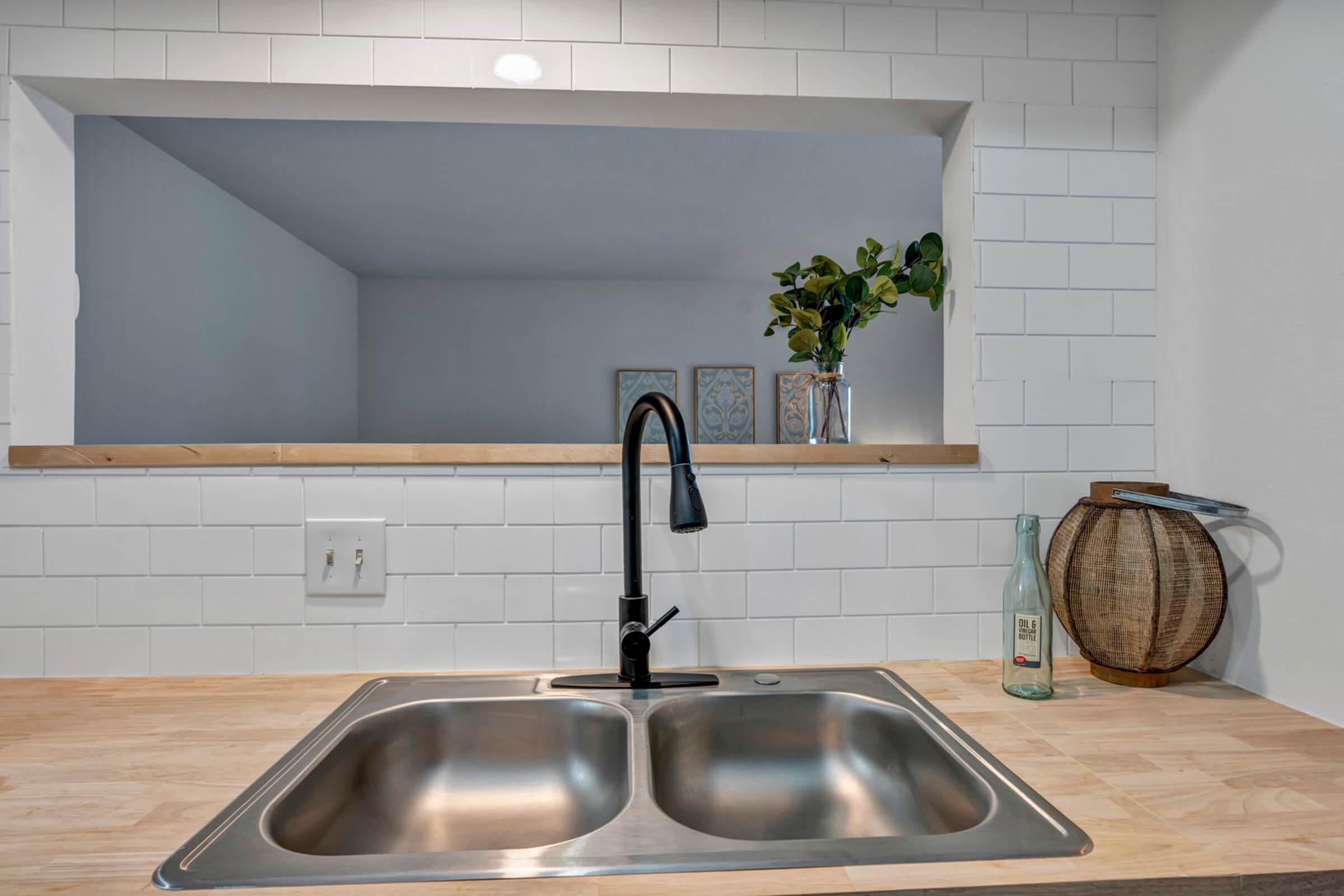 a stove top oven sitting inside of a kitchen