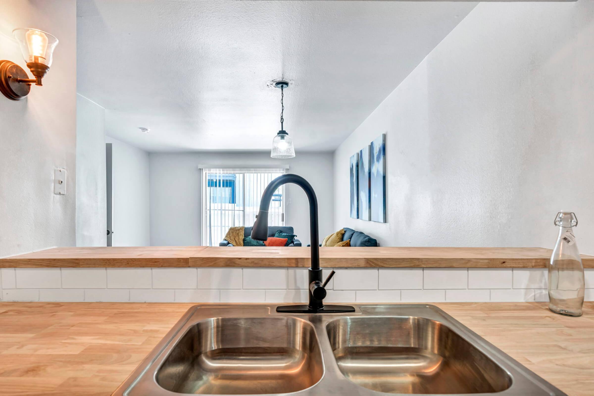 a kitchen with a sink and a microwave