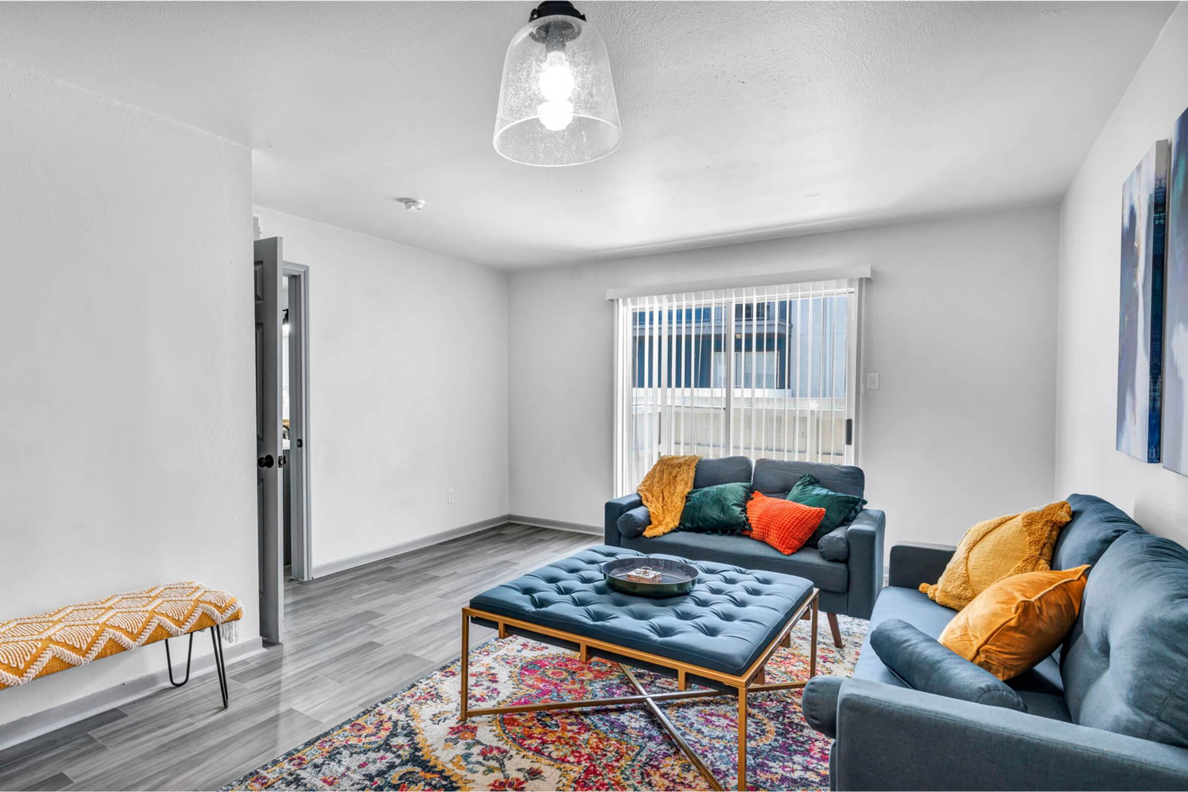 a living room filled with furniture and a fireplace