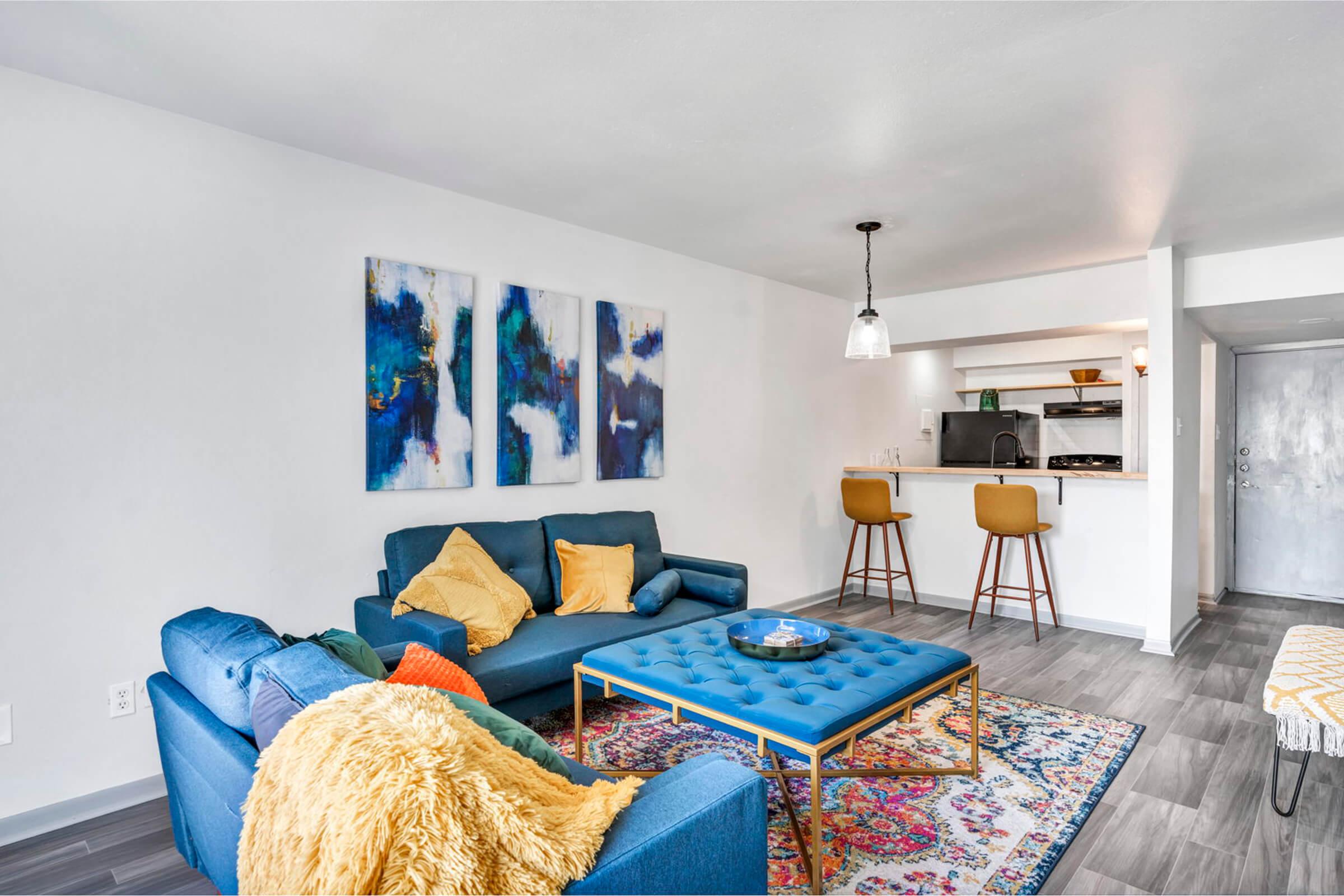 a living room with a blue blanket