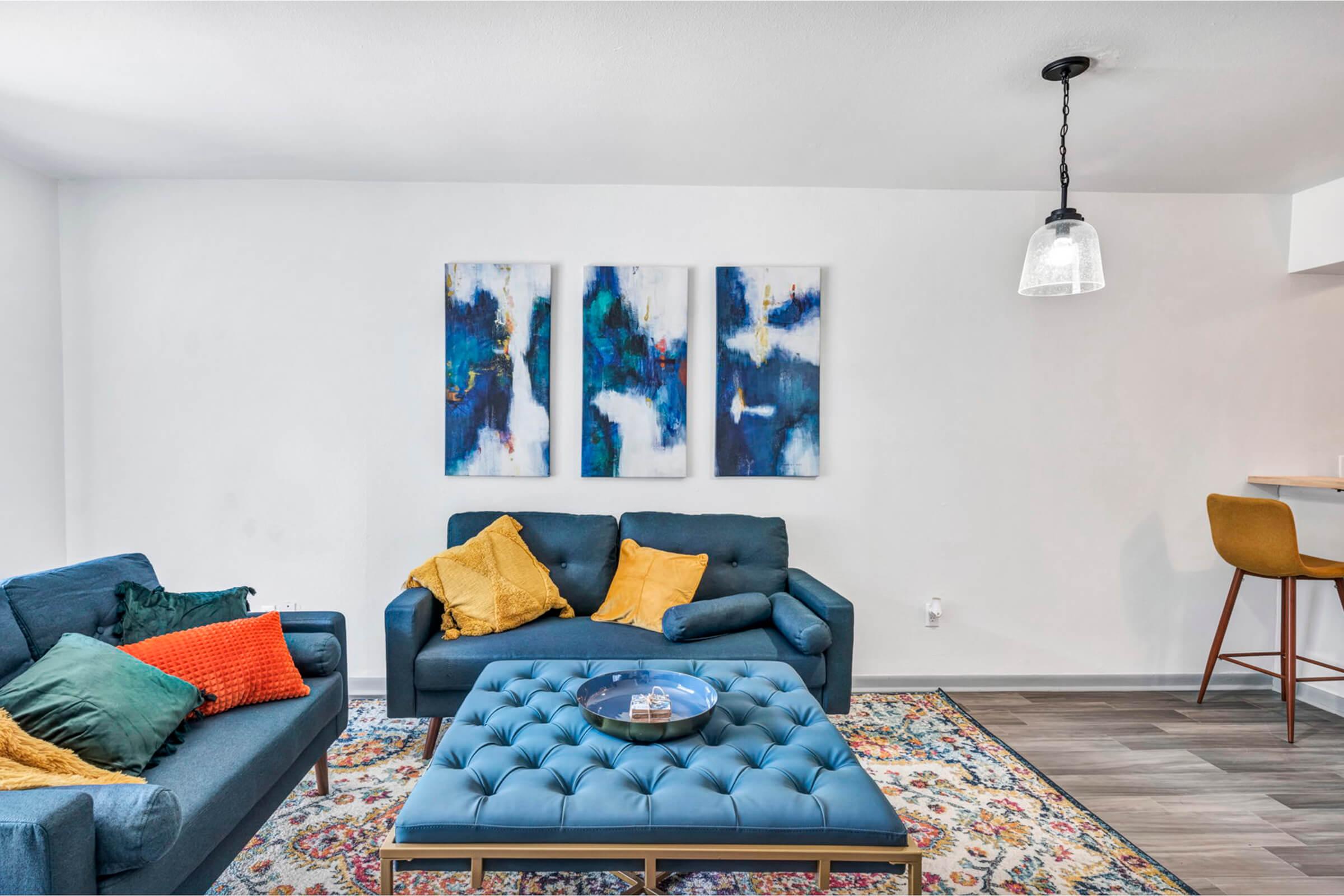 a living room filled with furniture and a rug