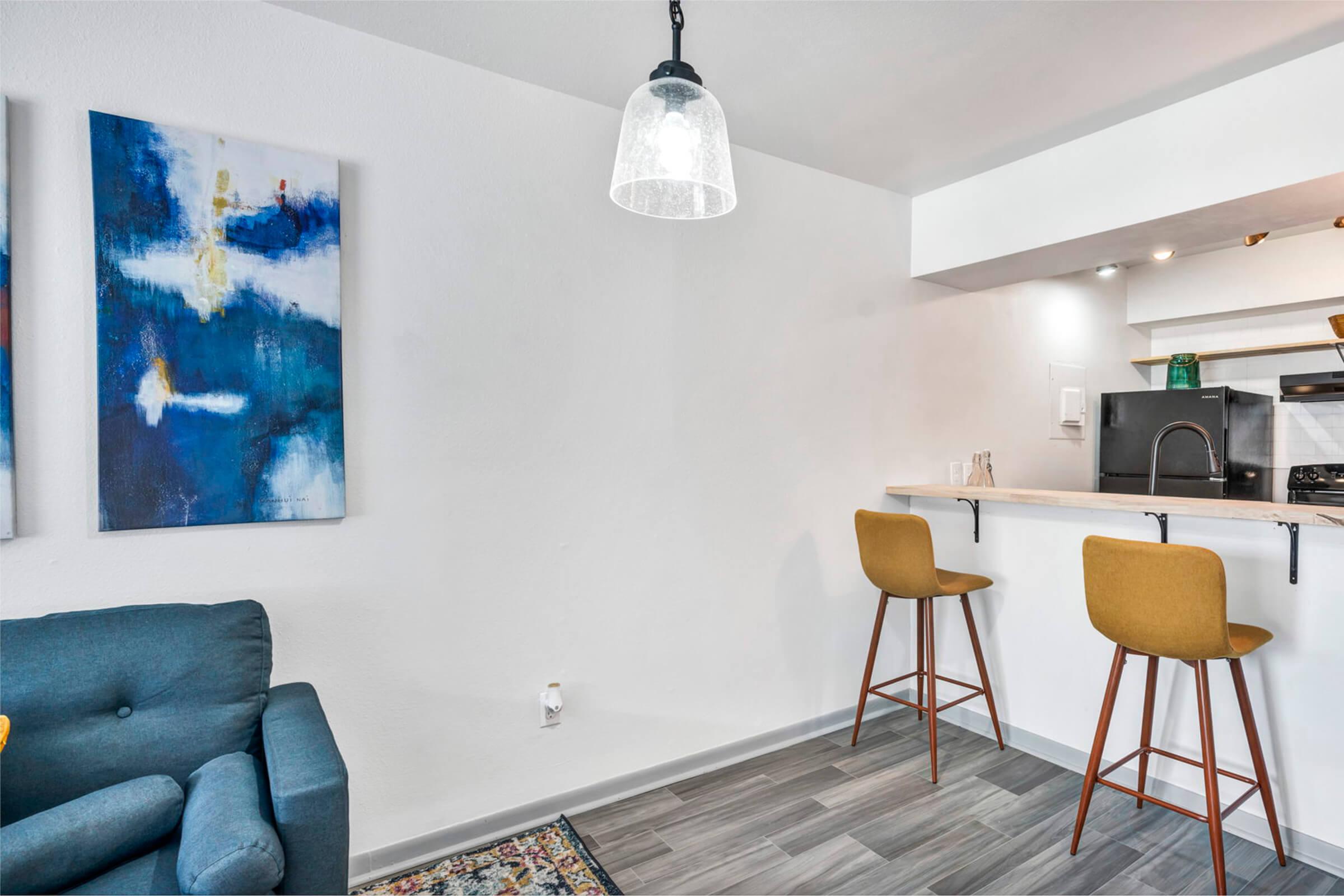 a living room filled with furniture and a table