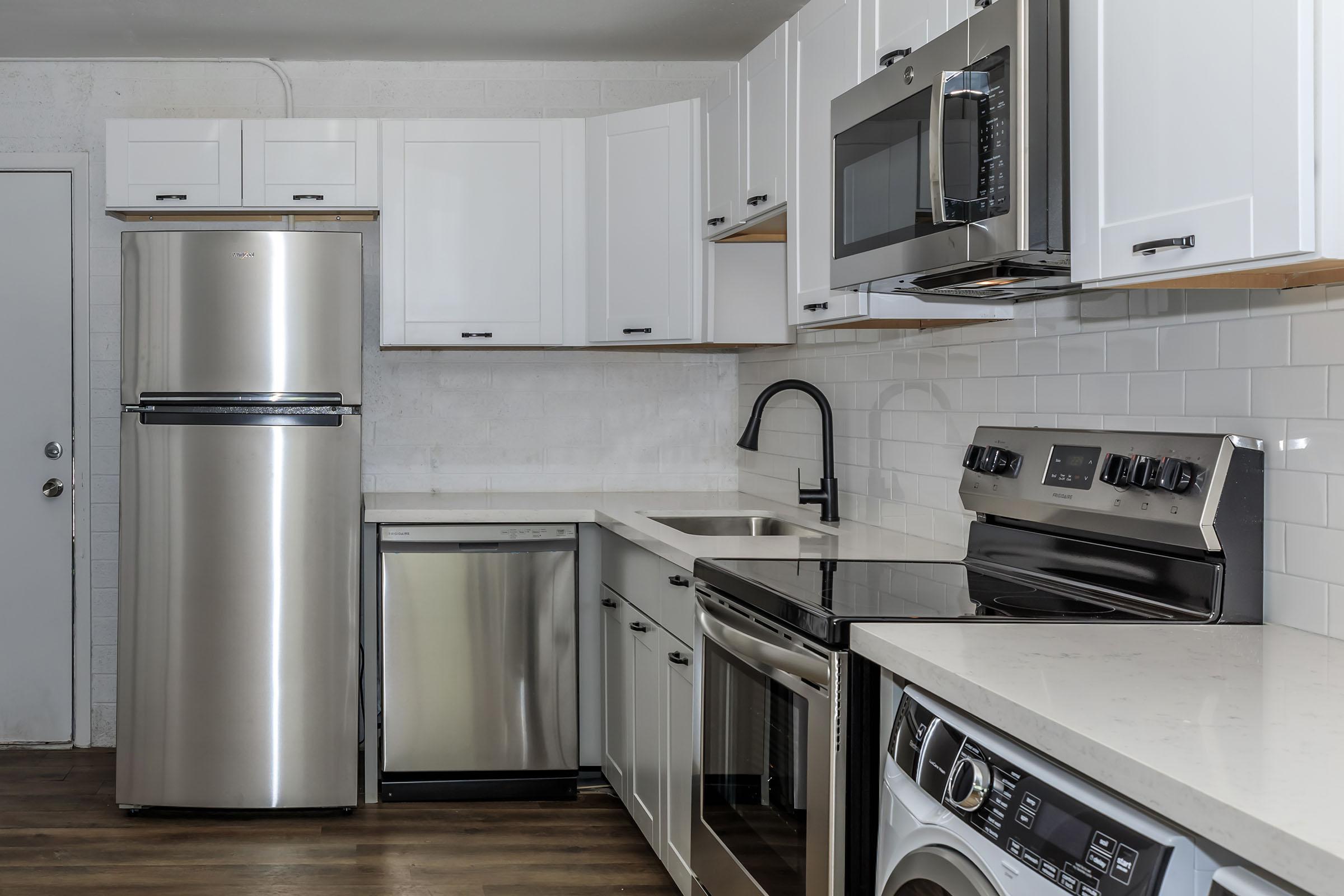 a kitchen with a stove top oven sitting inside of a refrigerator