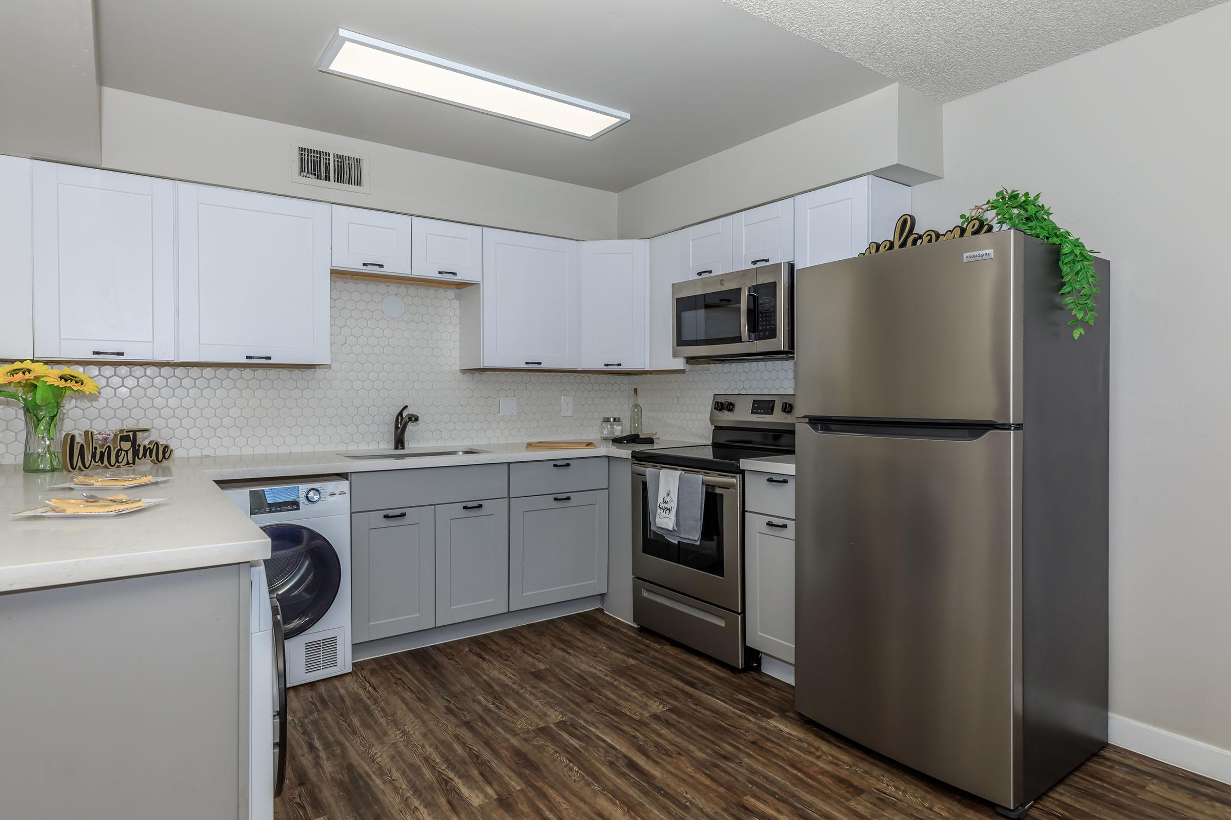 a kitchen with a stove and a refrigerator