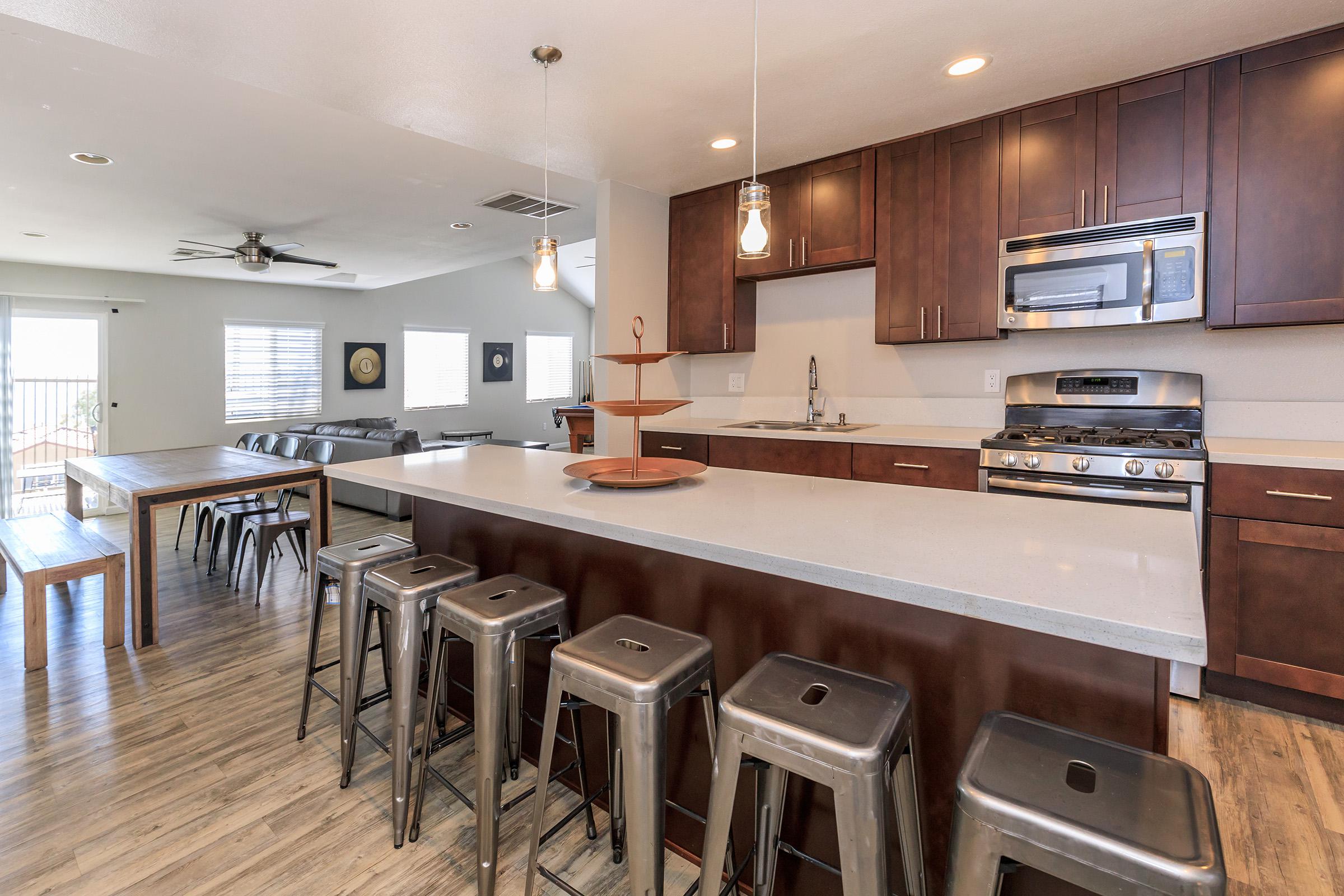 a large kitchen with stainless steel appliances