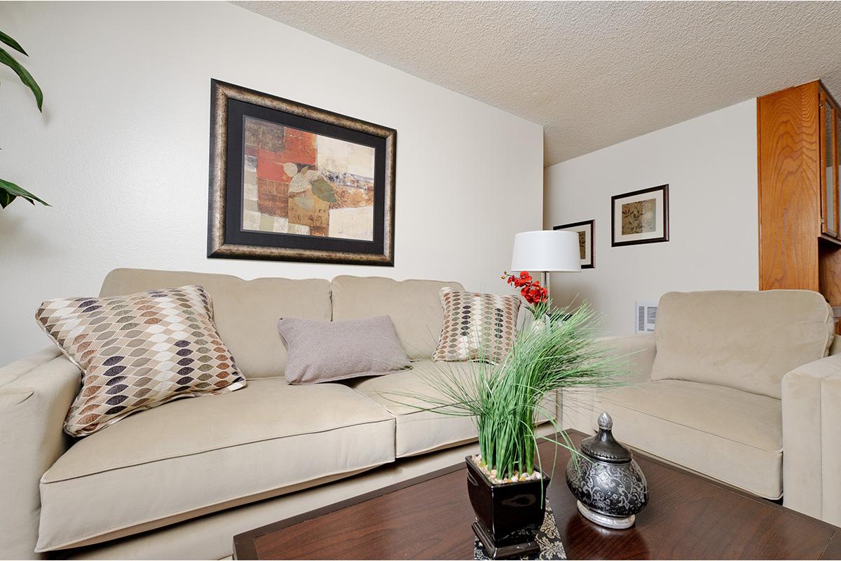 a brown leather couch in a living room