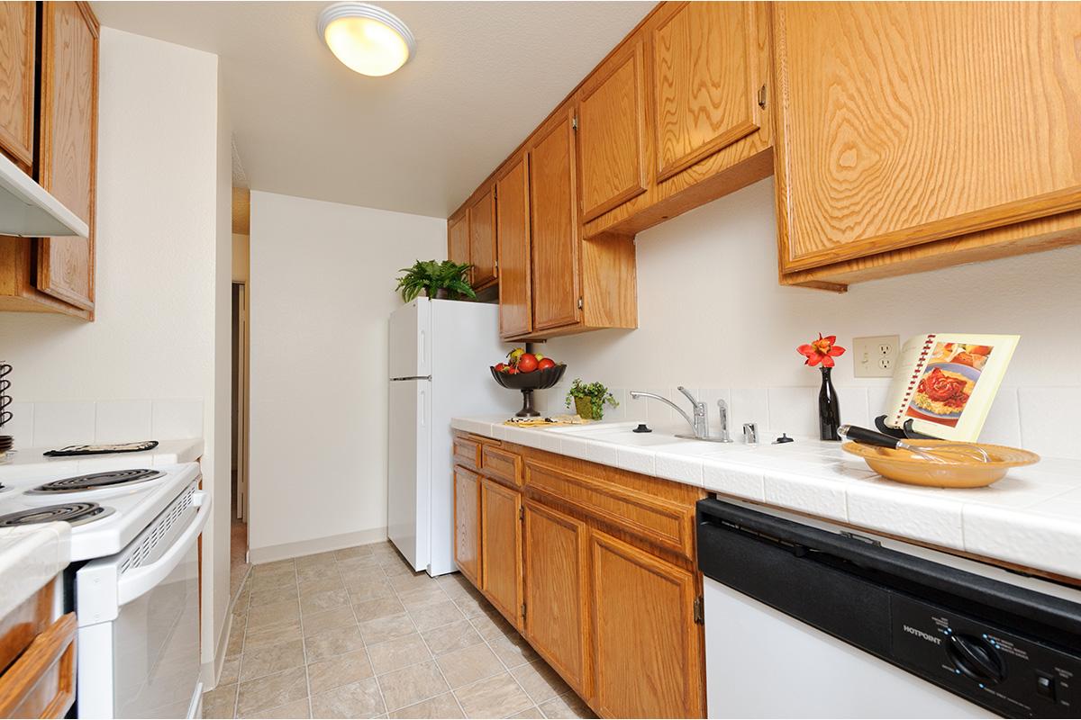 a kitchen with a sink and a refrigerator