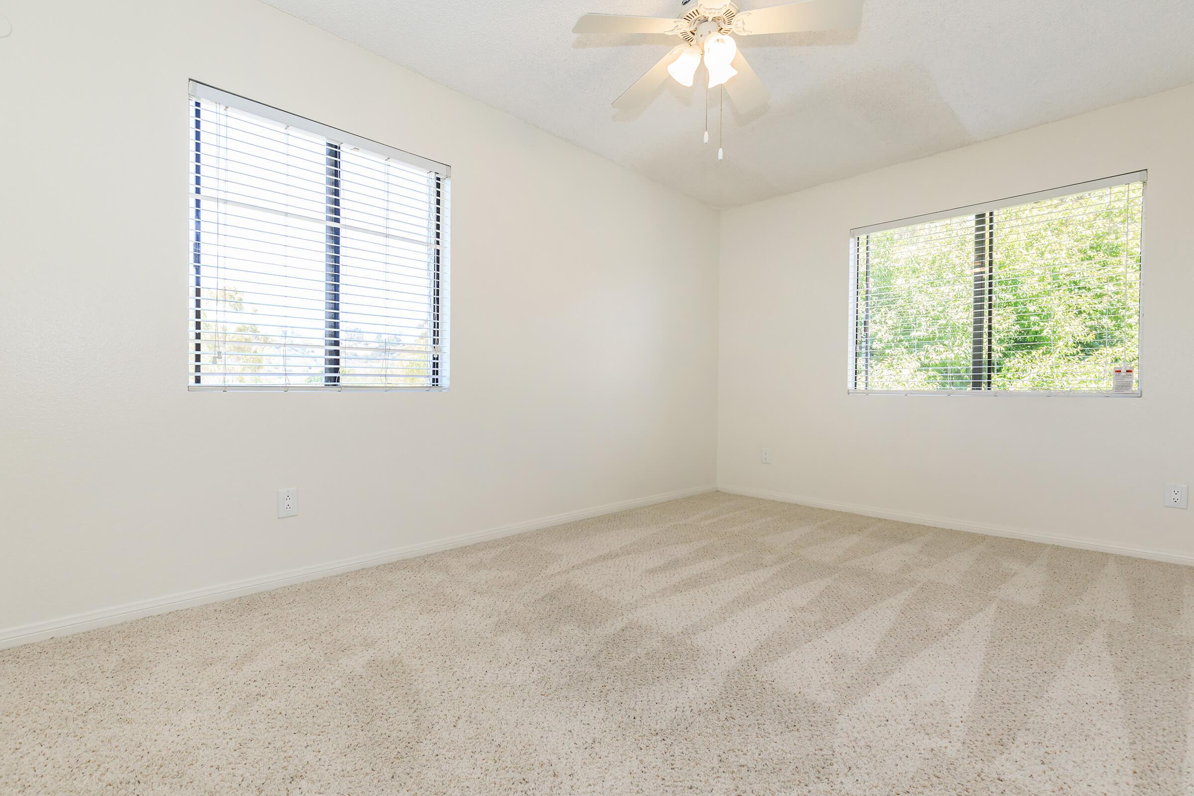 a bedroom with a large window