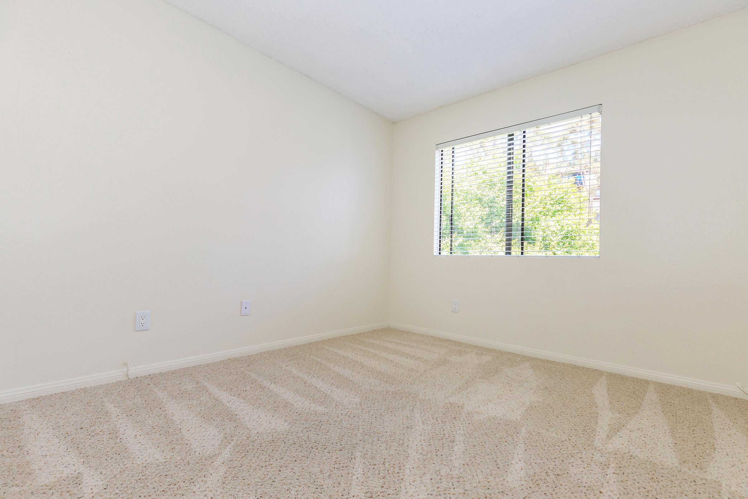 a bedroom with a large window