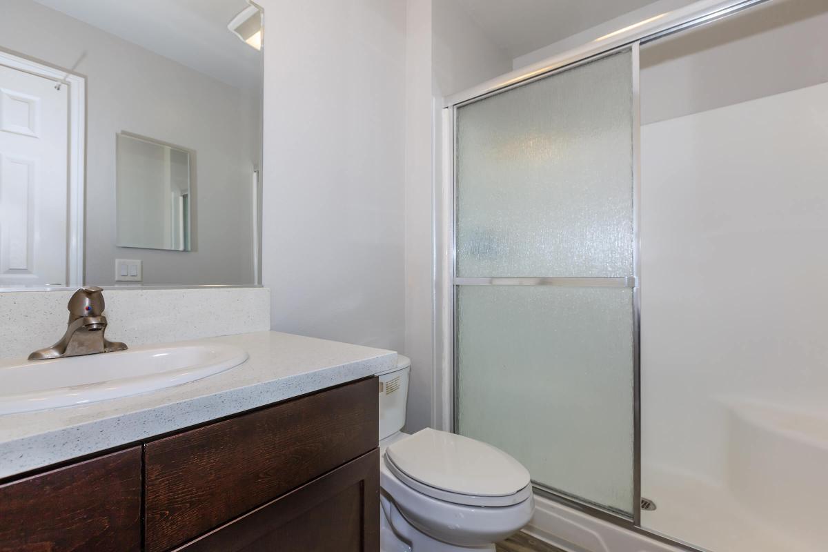 a white tub sitting next to a sink