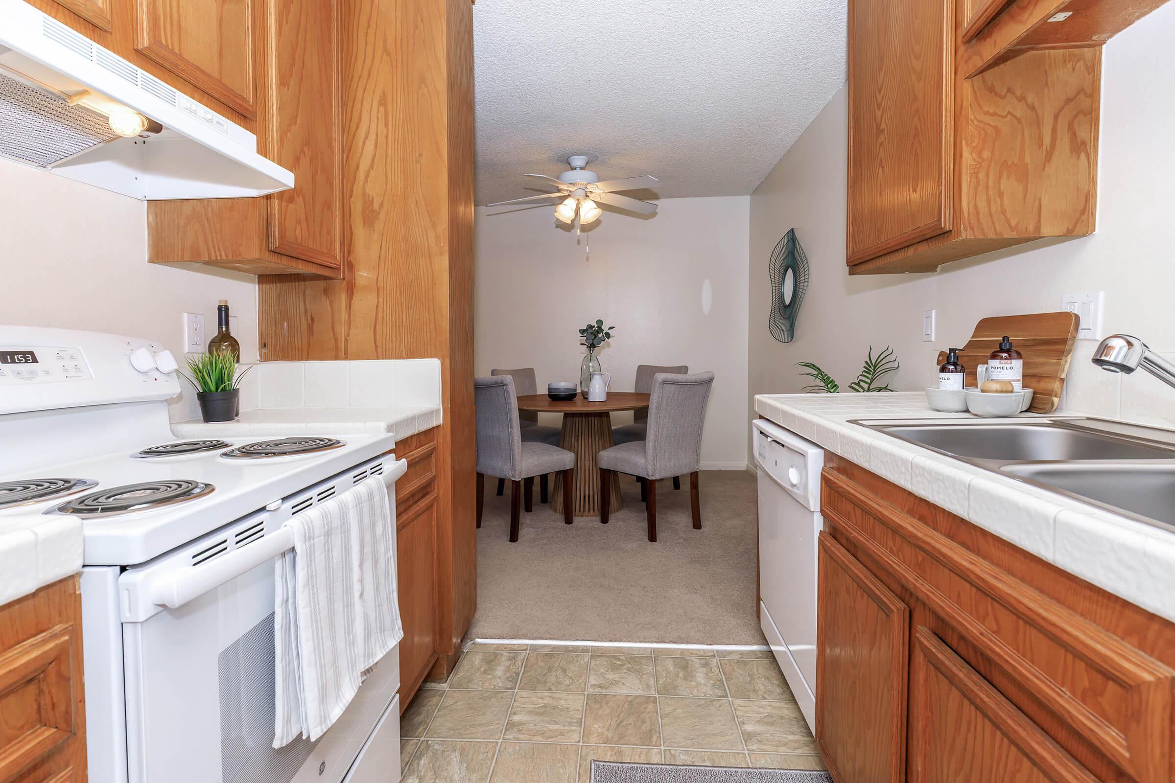 a kitchen with a sink and a refrigerator