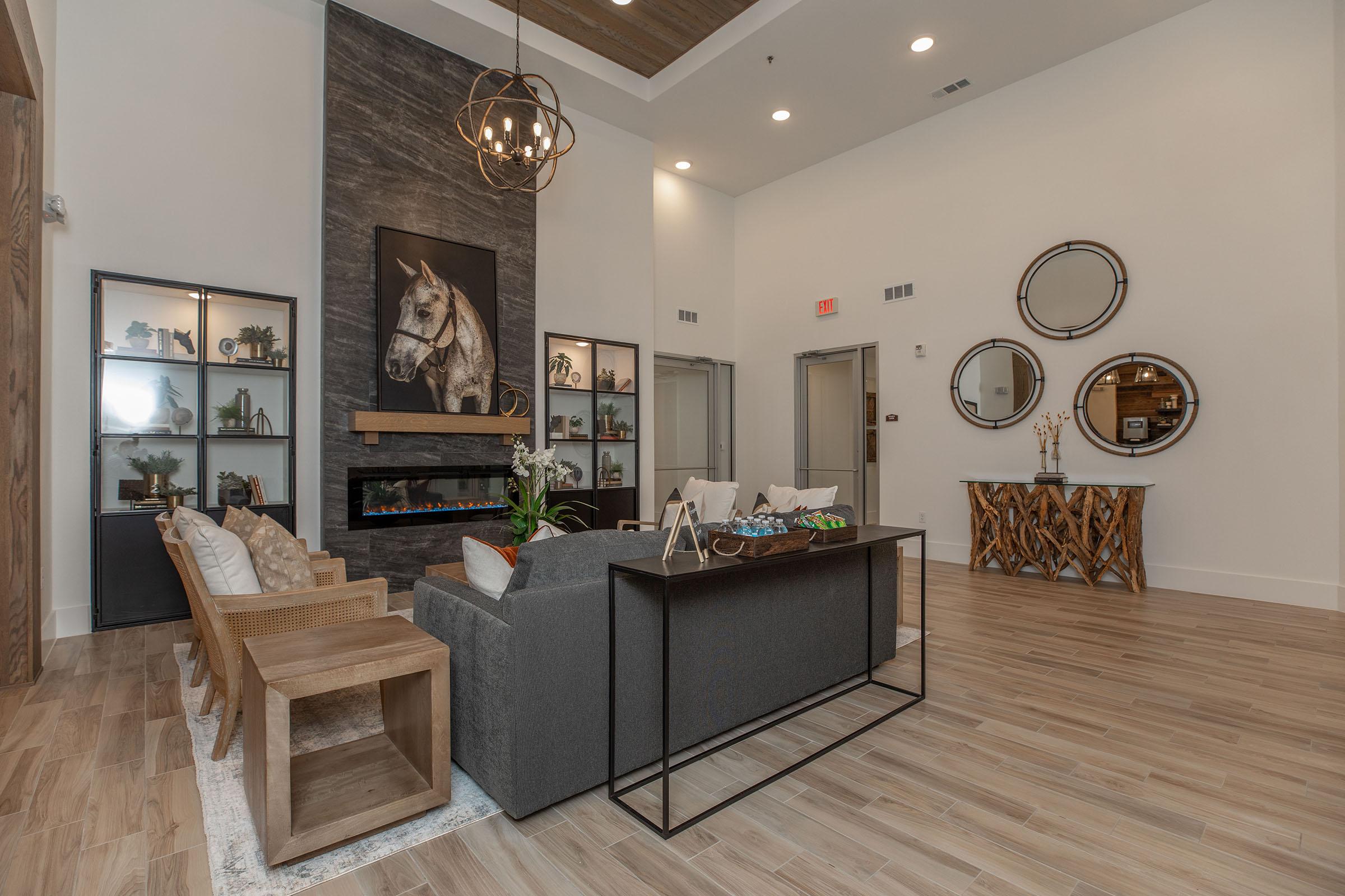 a living room filled with furniture and a fireplace