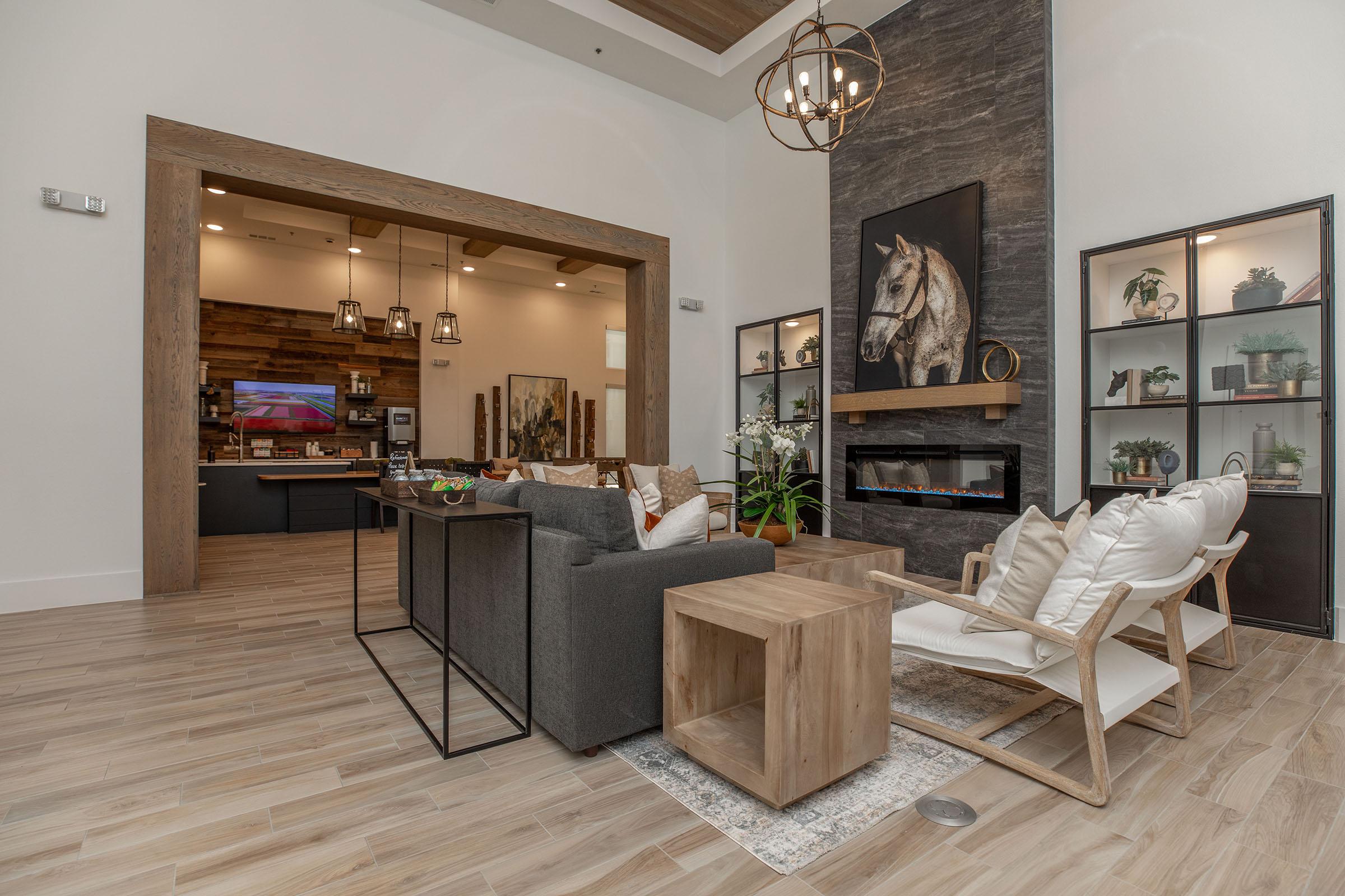 a living room filled with furniture and a fireplace