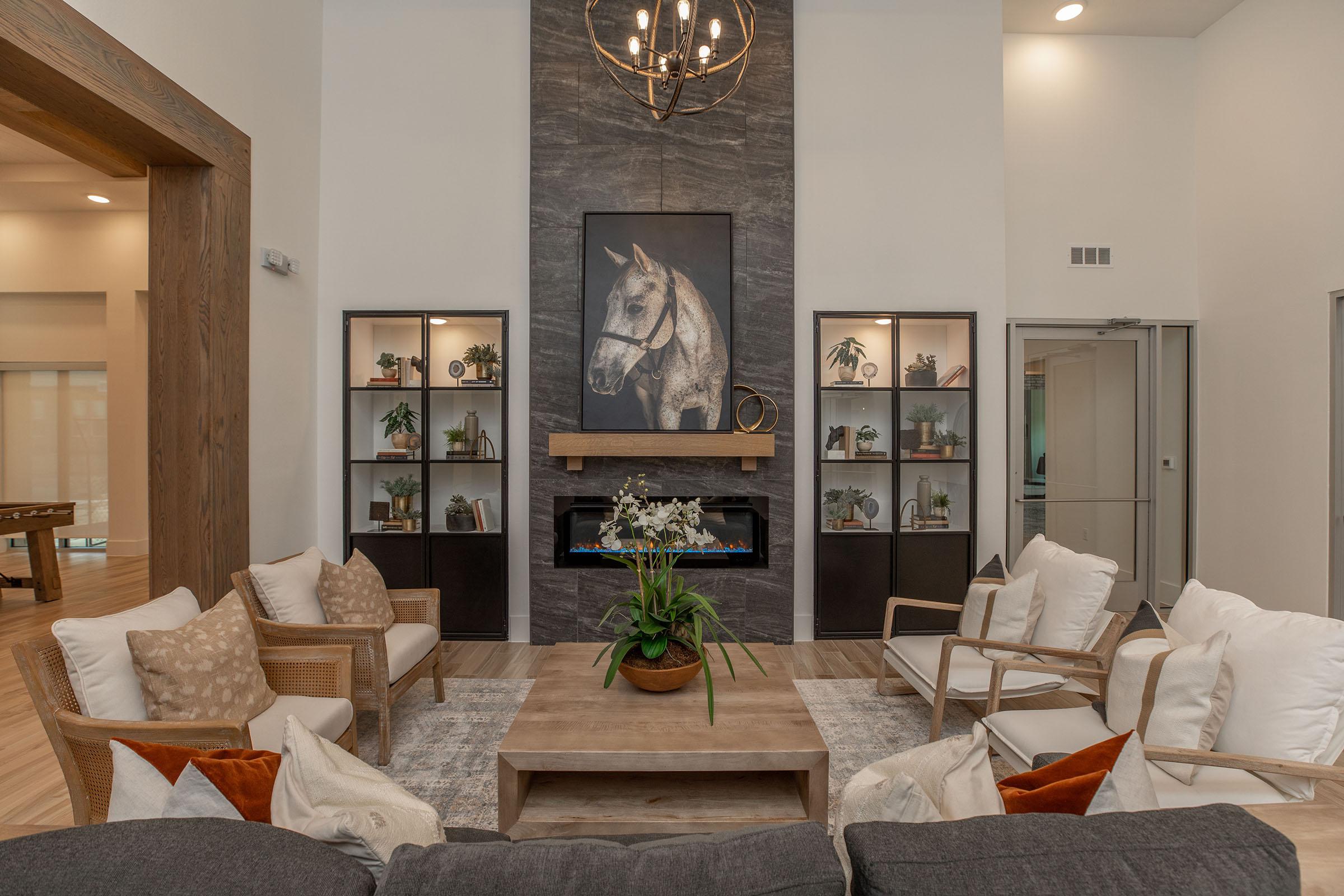 a living room filled with furniture and a fire place