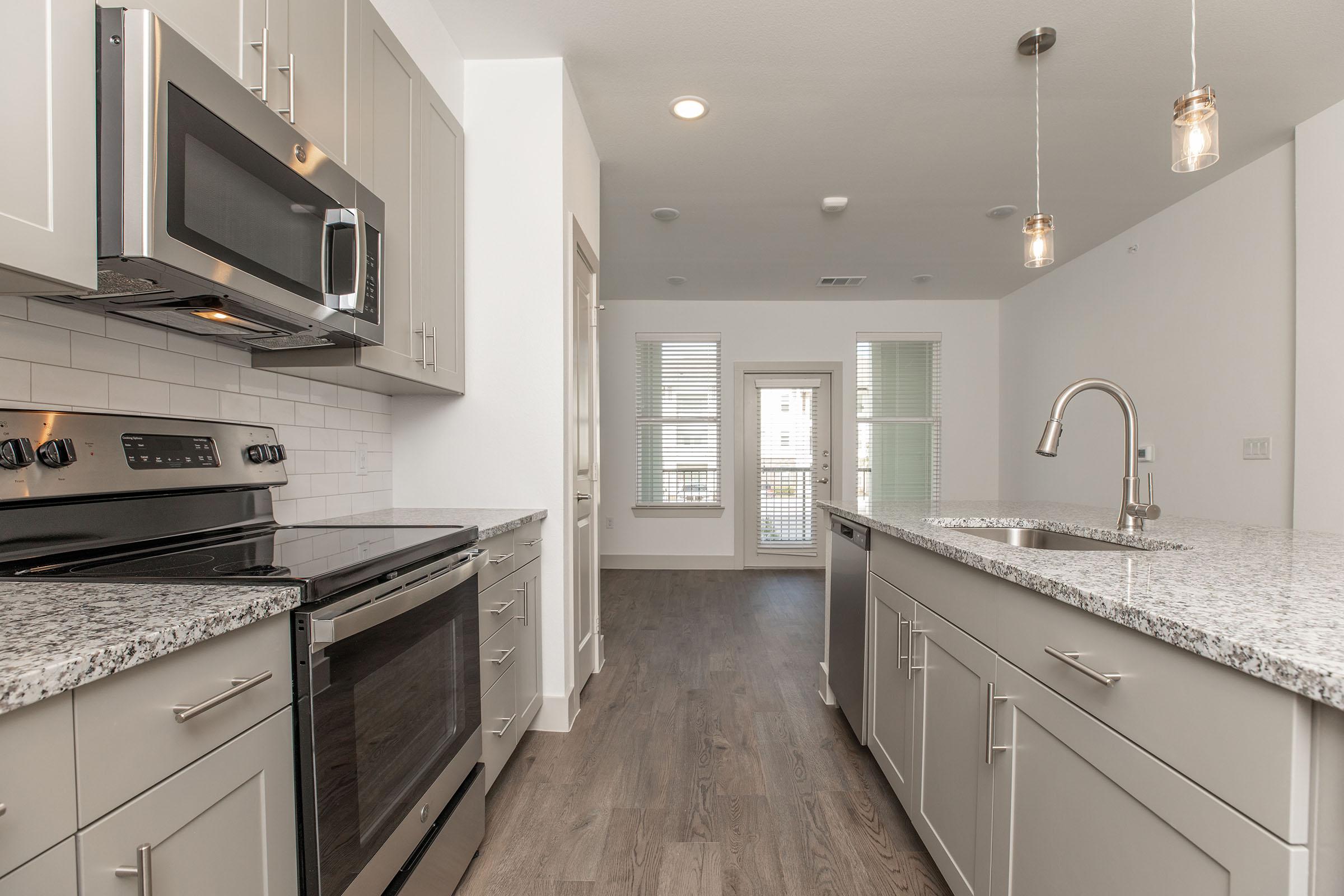an island in the middle of a kitchen