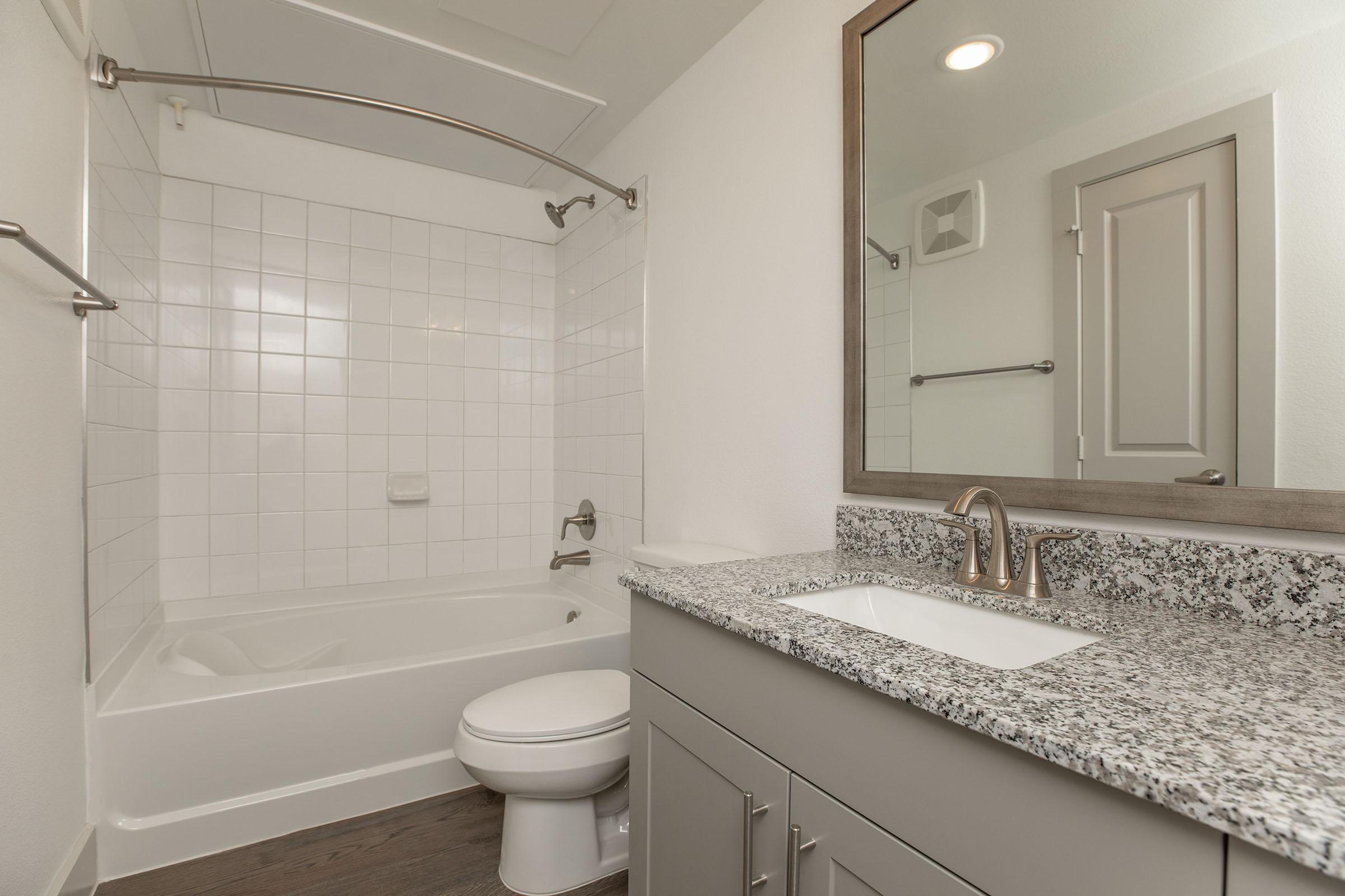 a room with a sink and a mirror