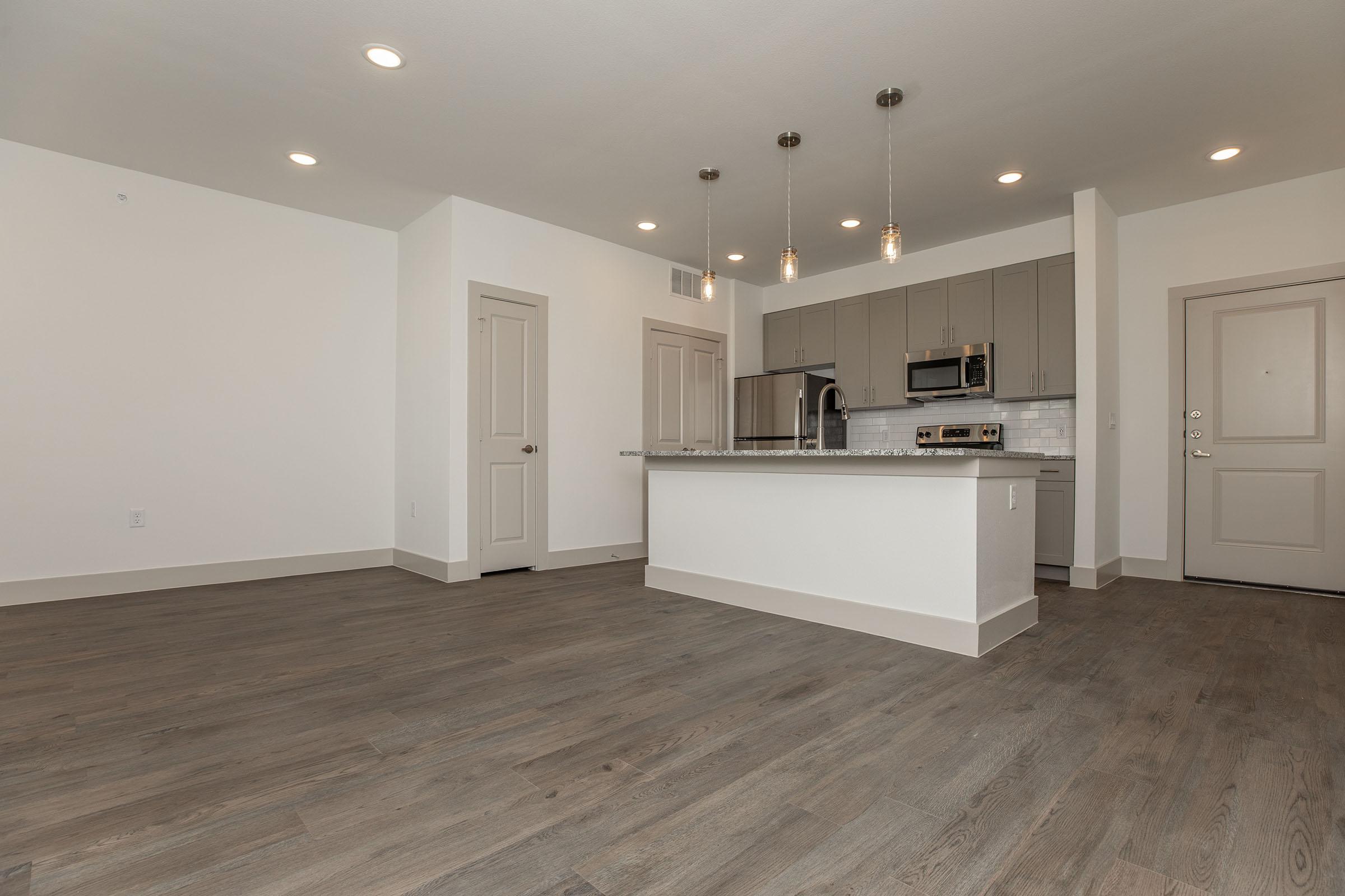 a kitchen with a building in the background