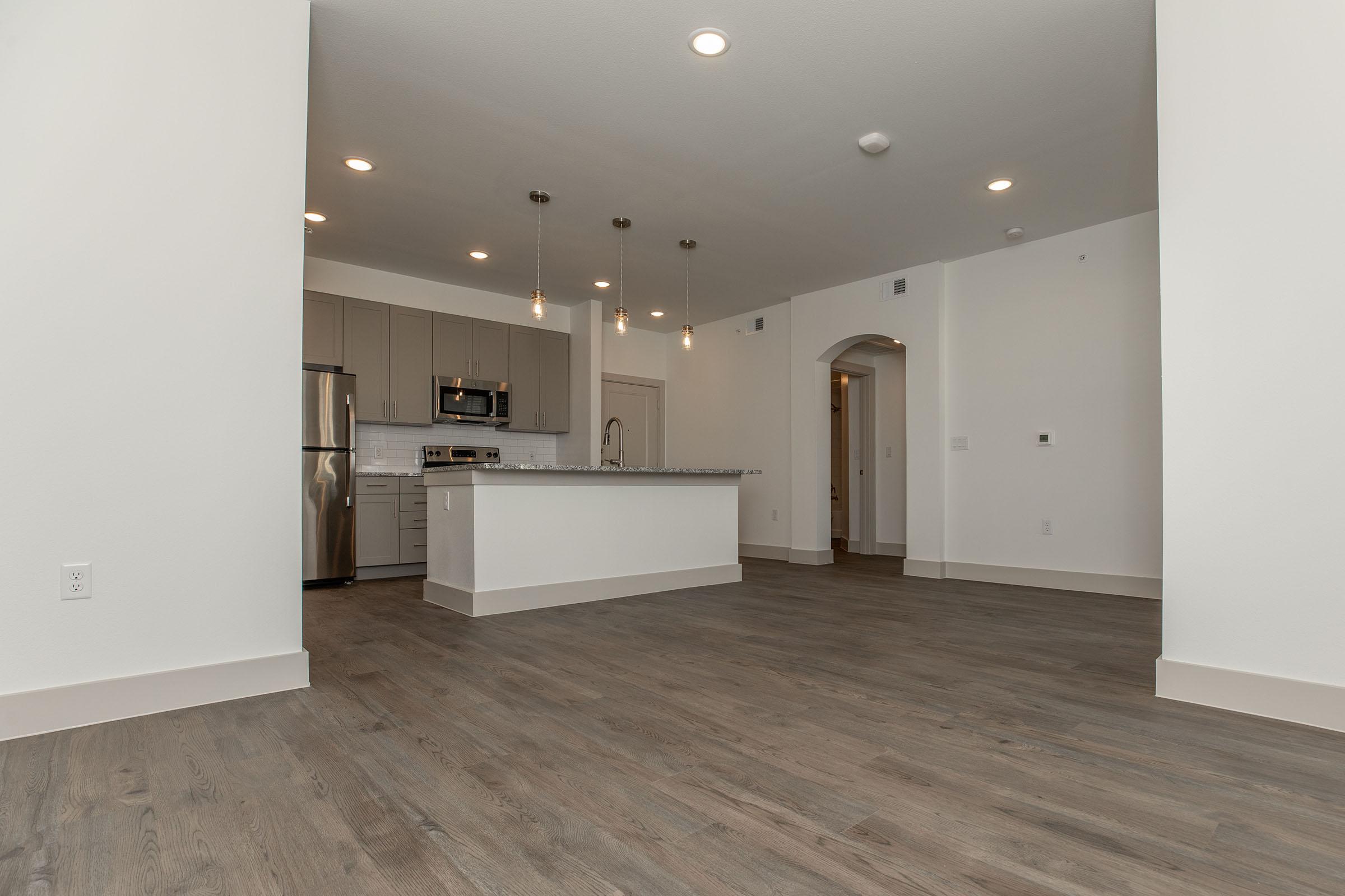 a kitchen with a building in the background