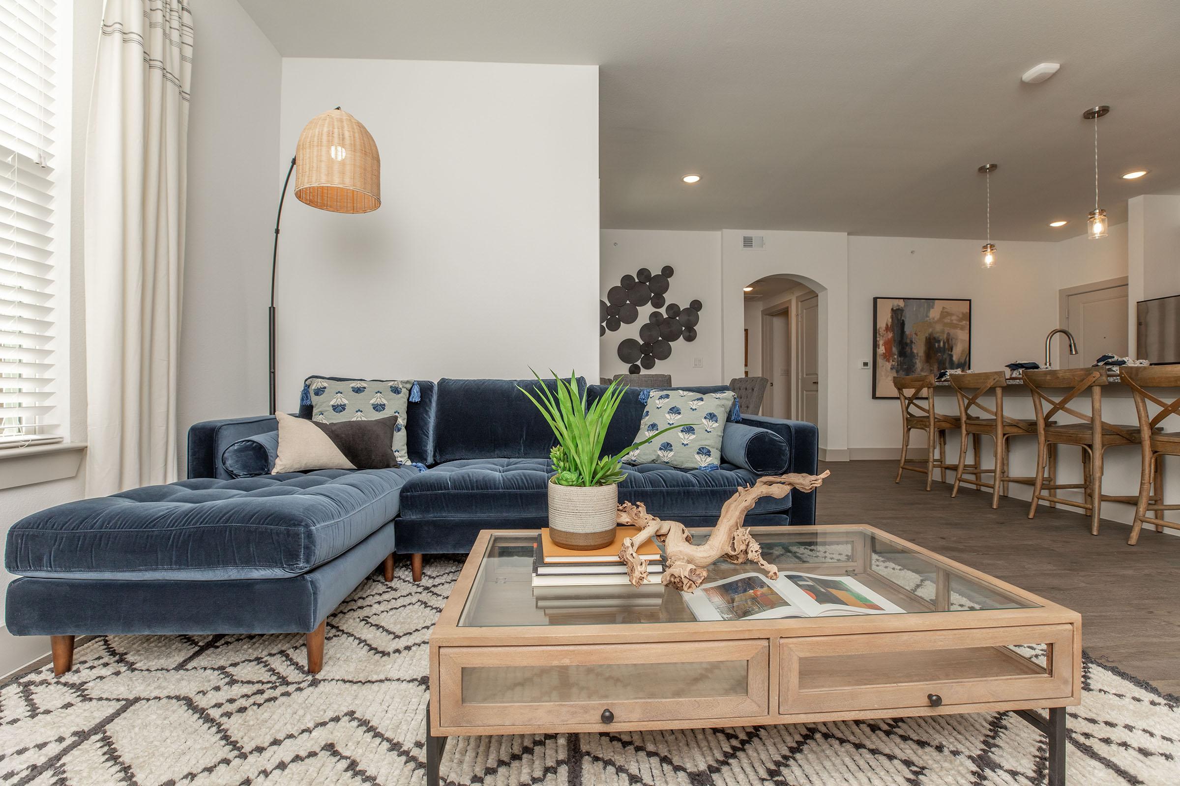 a living room filled with furniture and a table