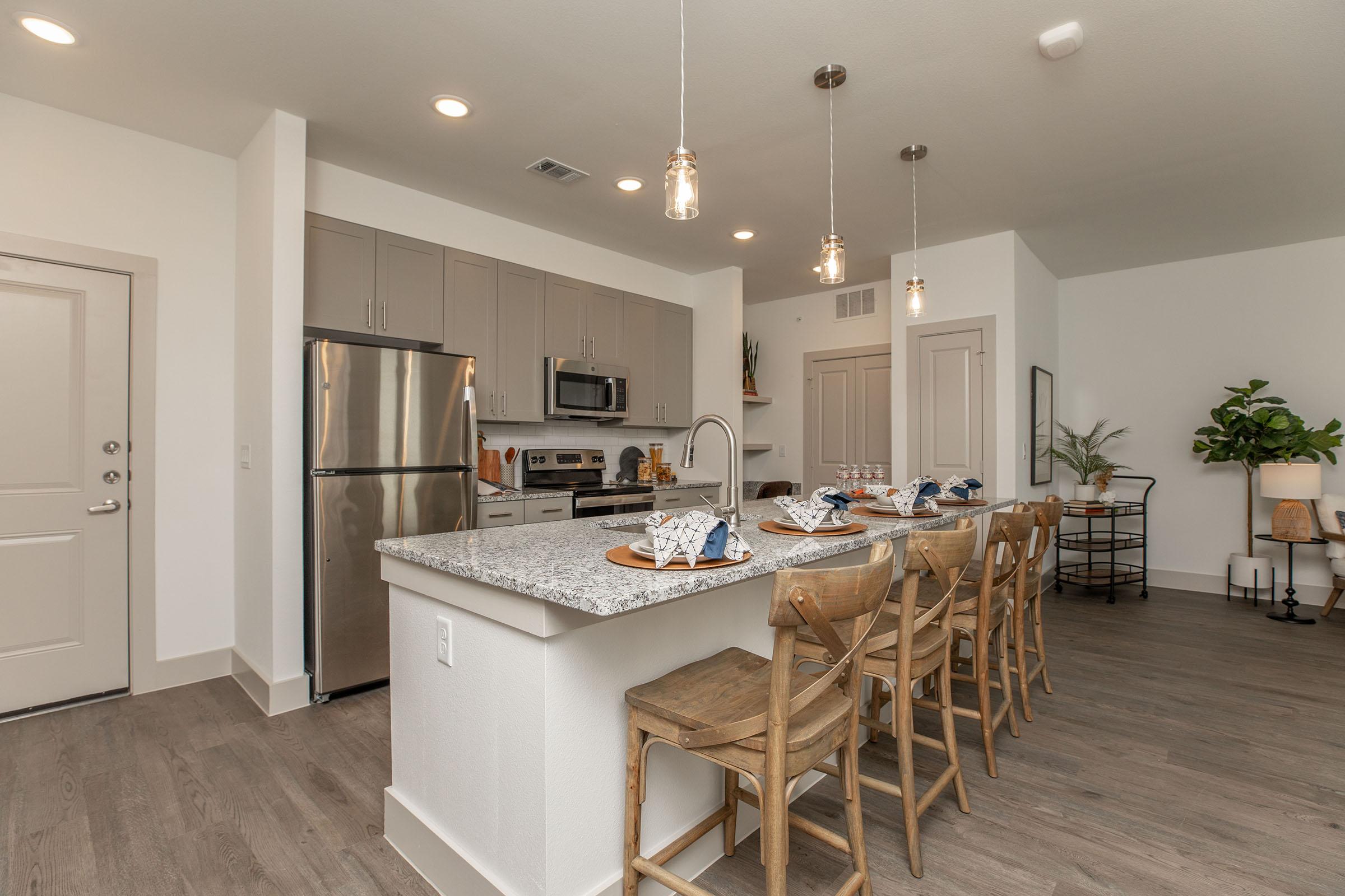 a kitchen with a dining room table
