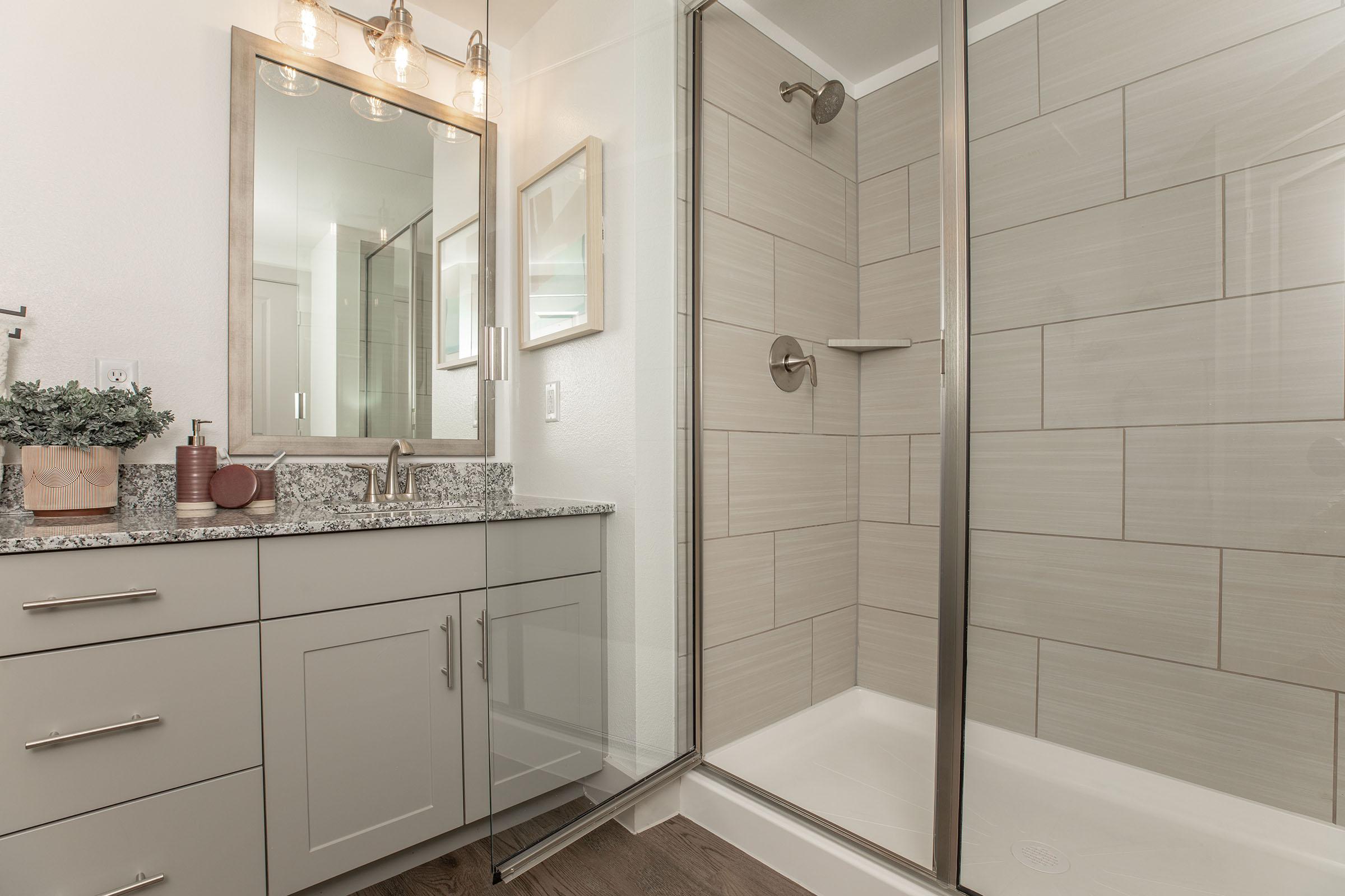 a room with a sink and a mirror