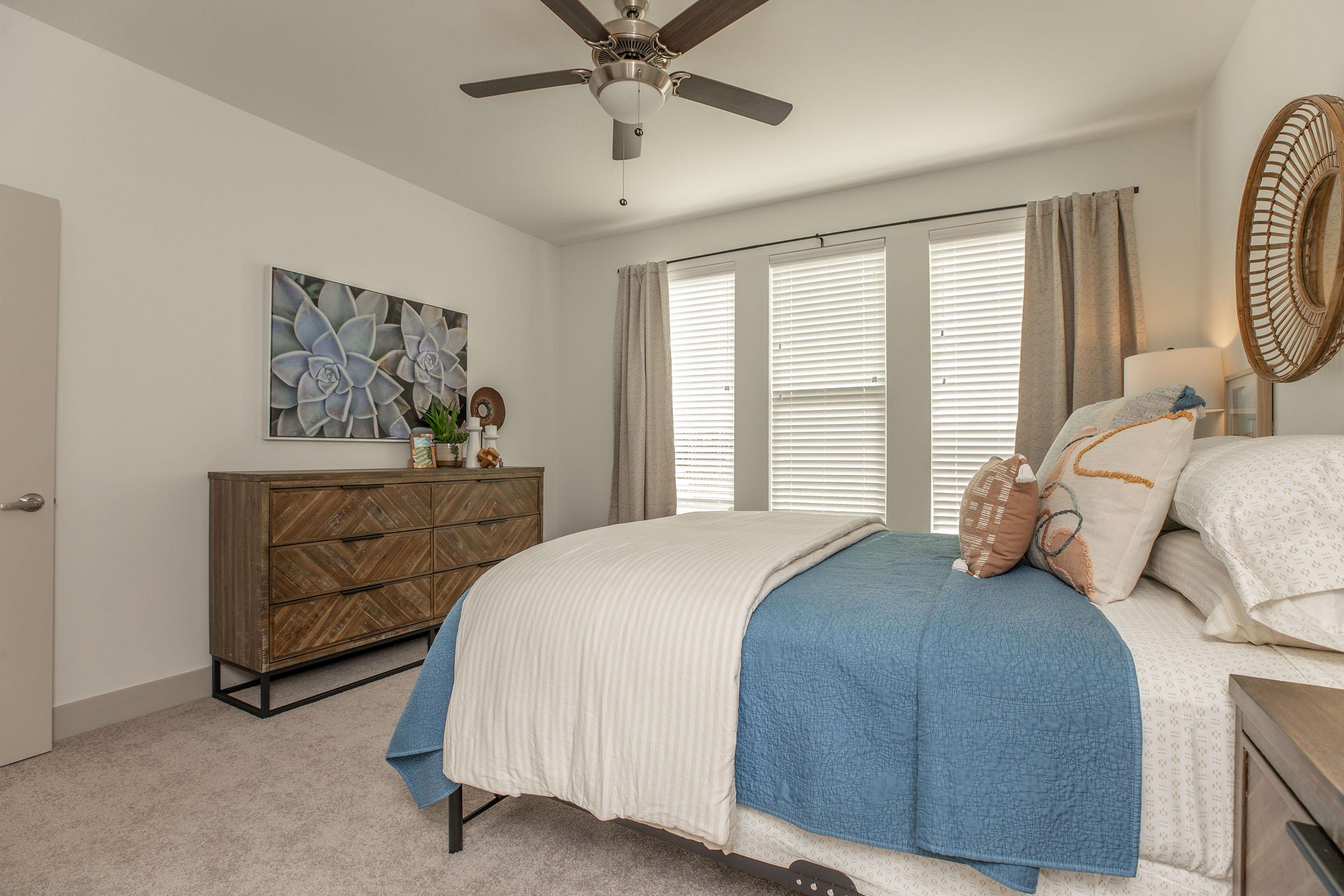 a bedroom with a bed in a room