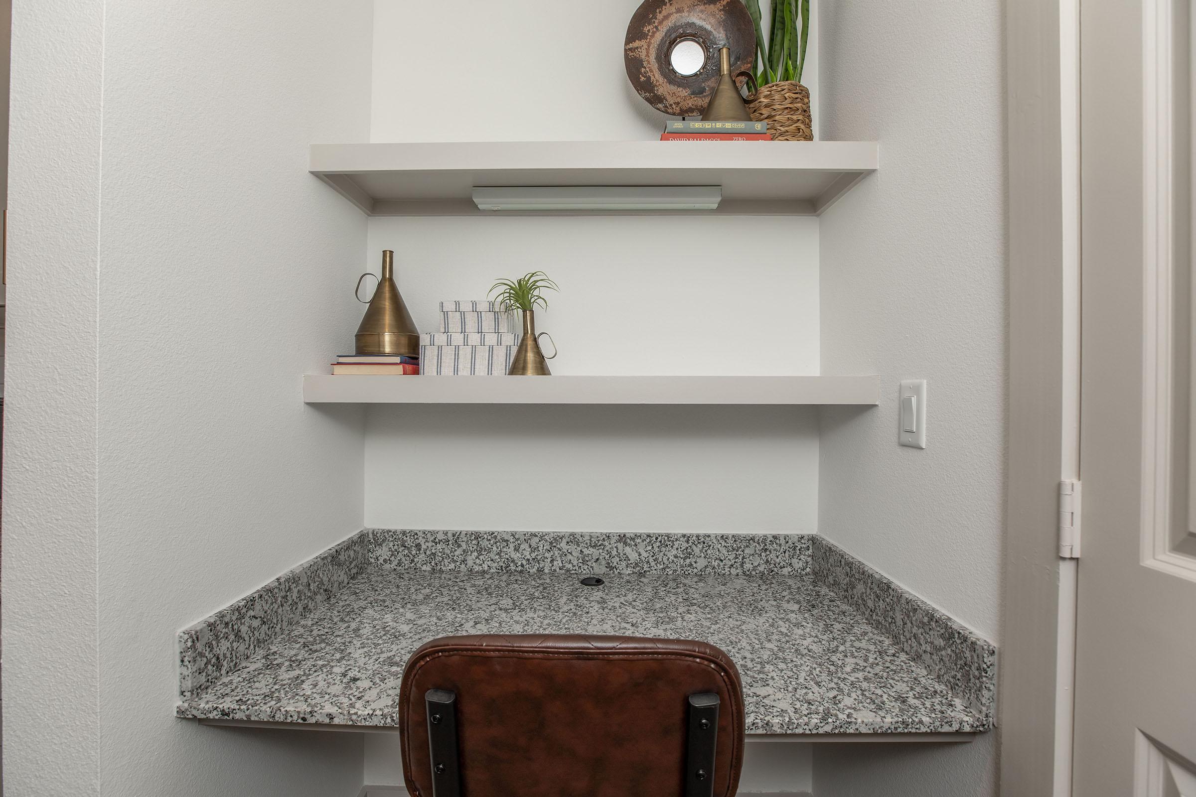a room with a sink and a mirror