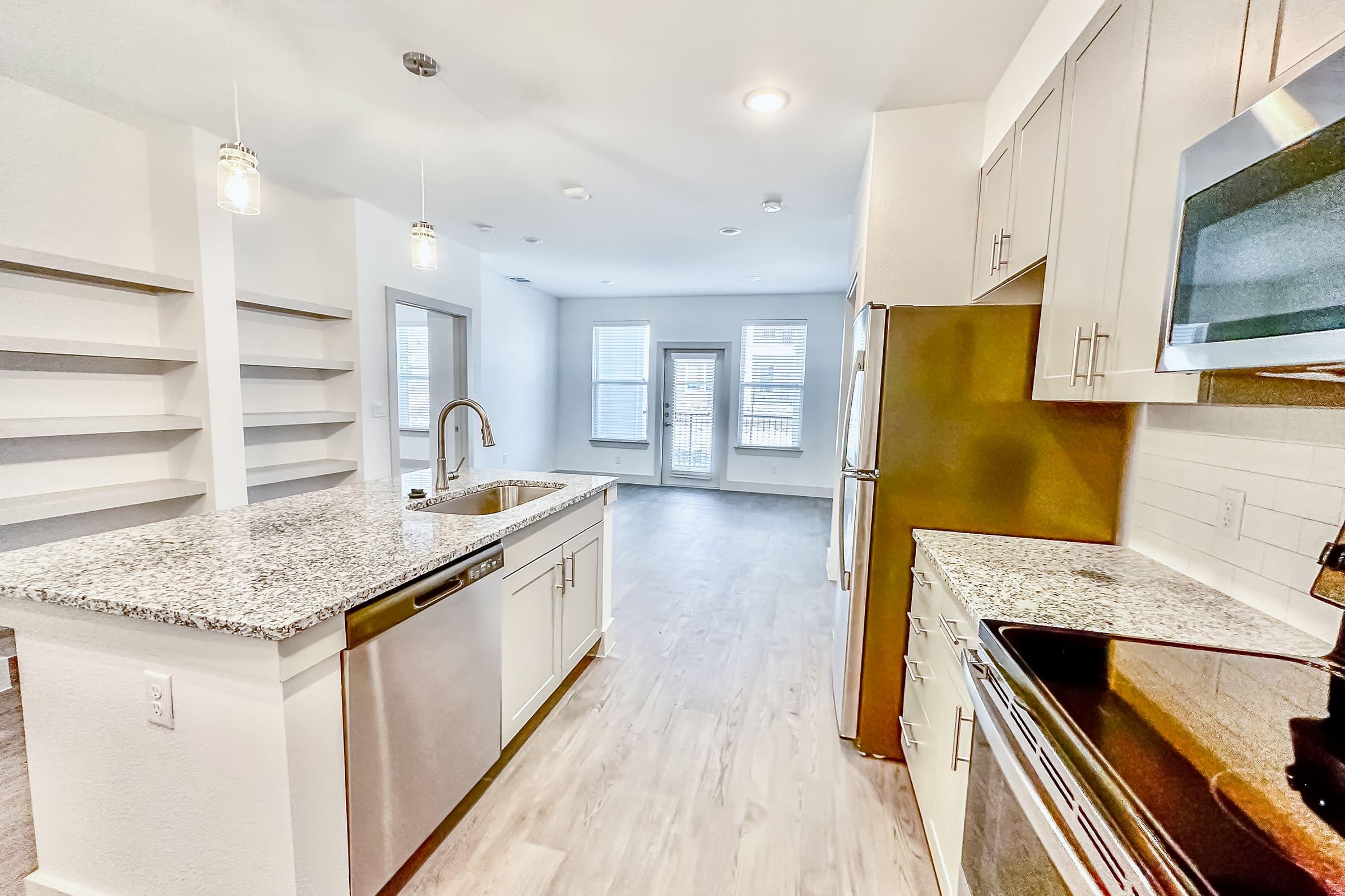 a kitchen with a wood floor