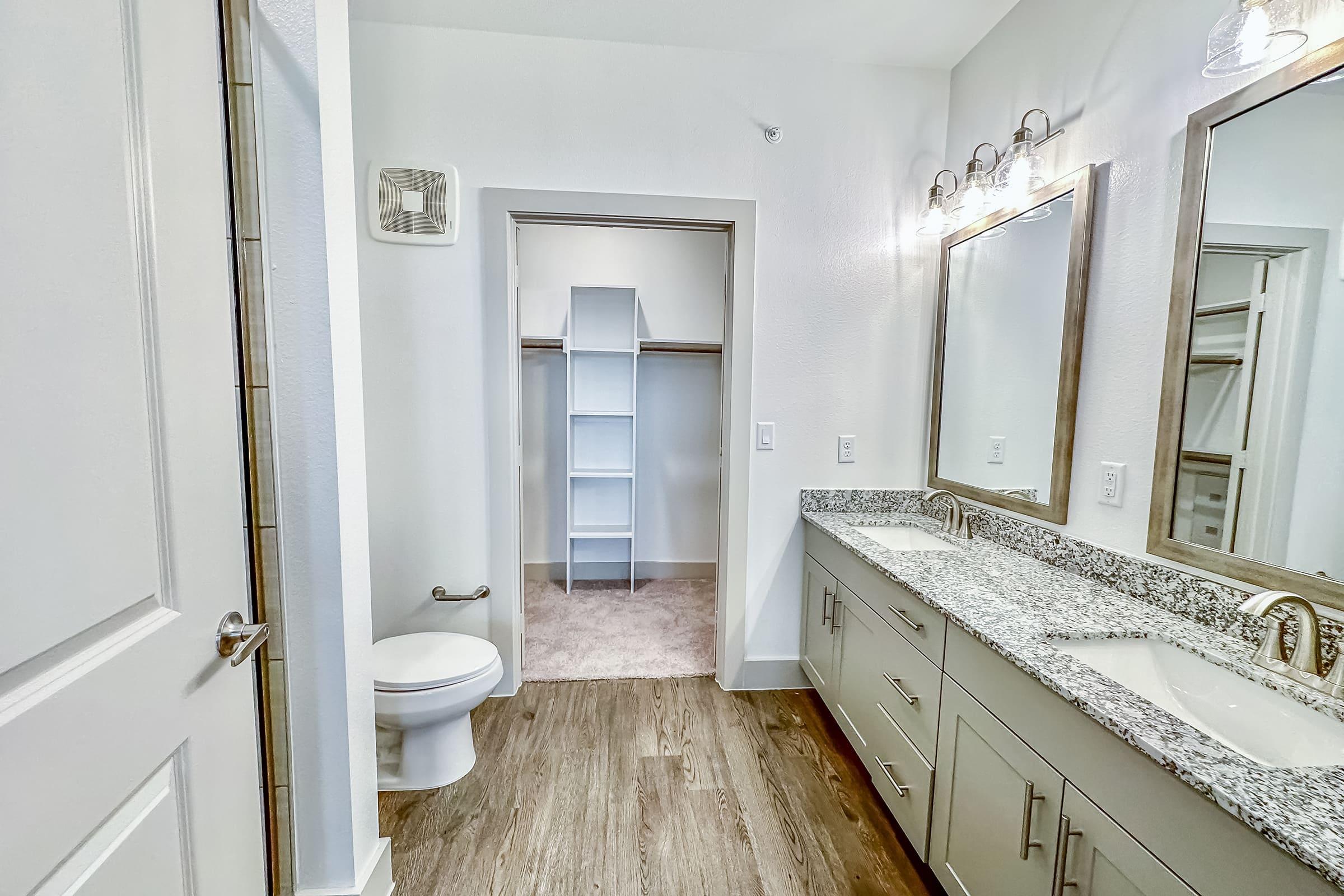 a room with a sink and a mirror