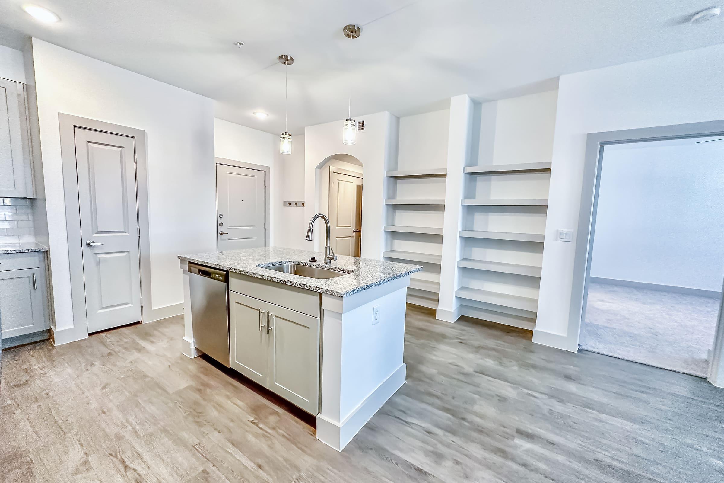 a kitchen with a wood floor