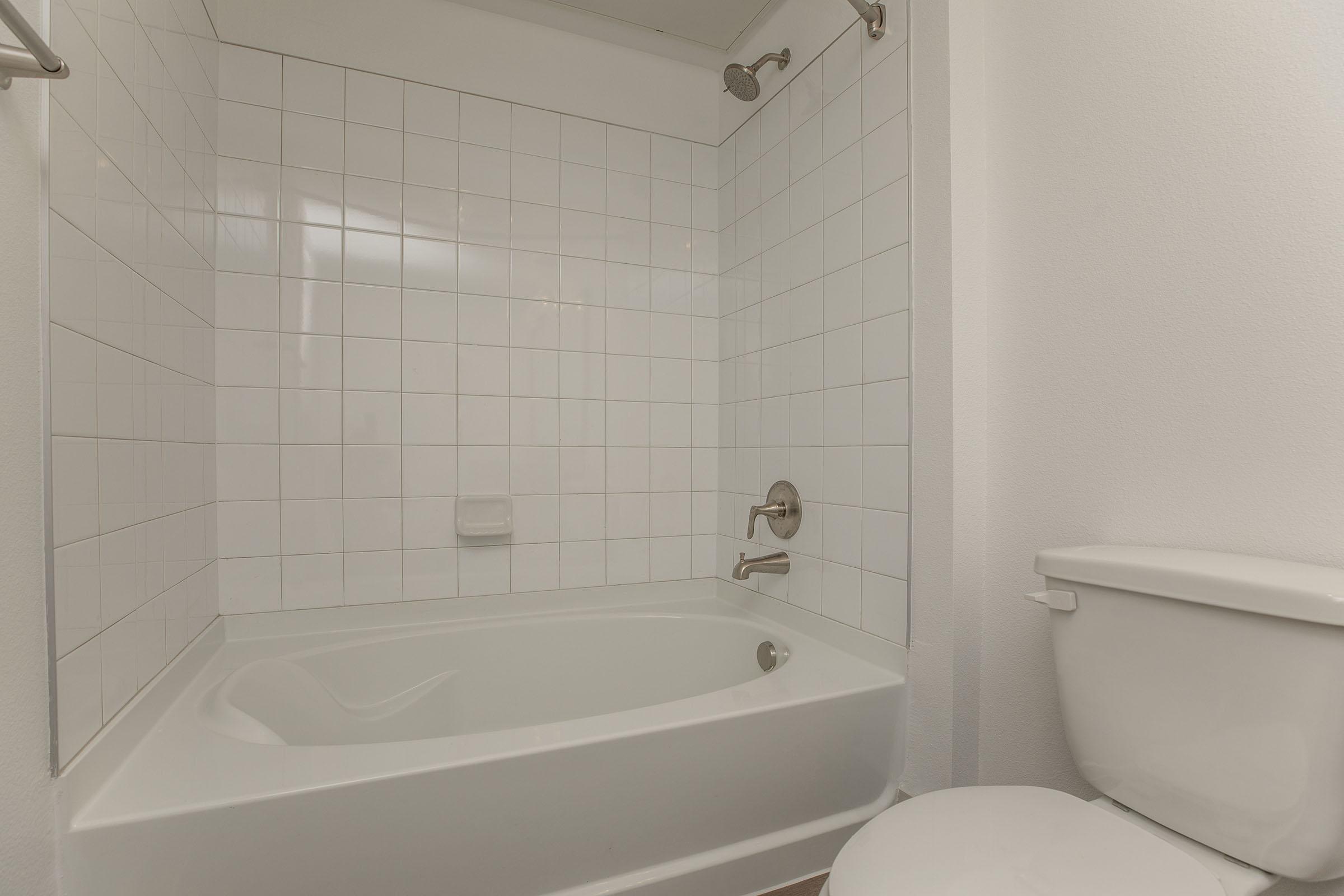 a close up of a sink and a bath tub