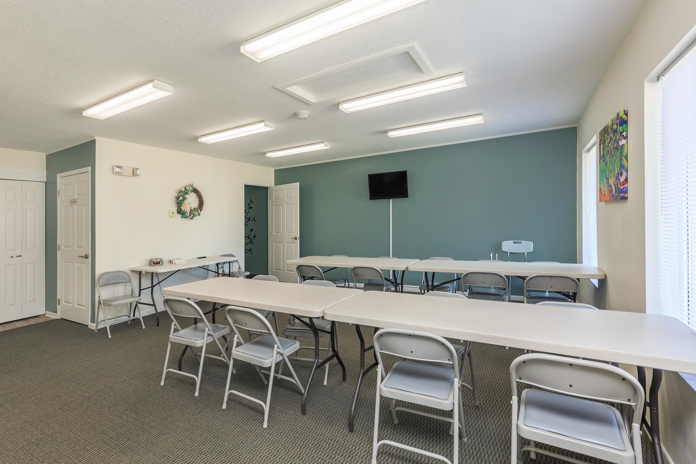 a large room with tables and chairs