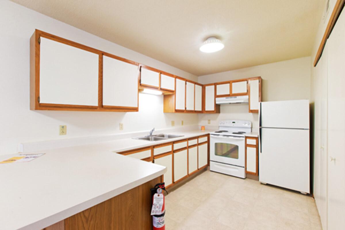 a kitchen with a wood floor