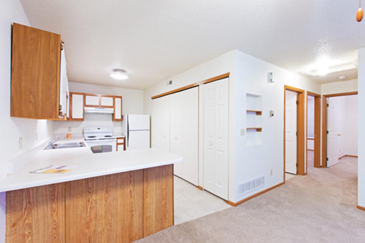 a kitchen with a wood floor