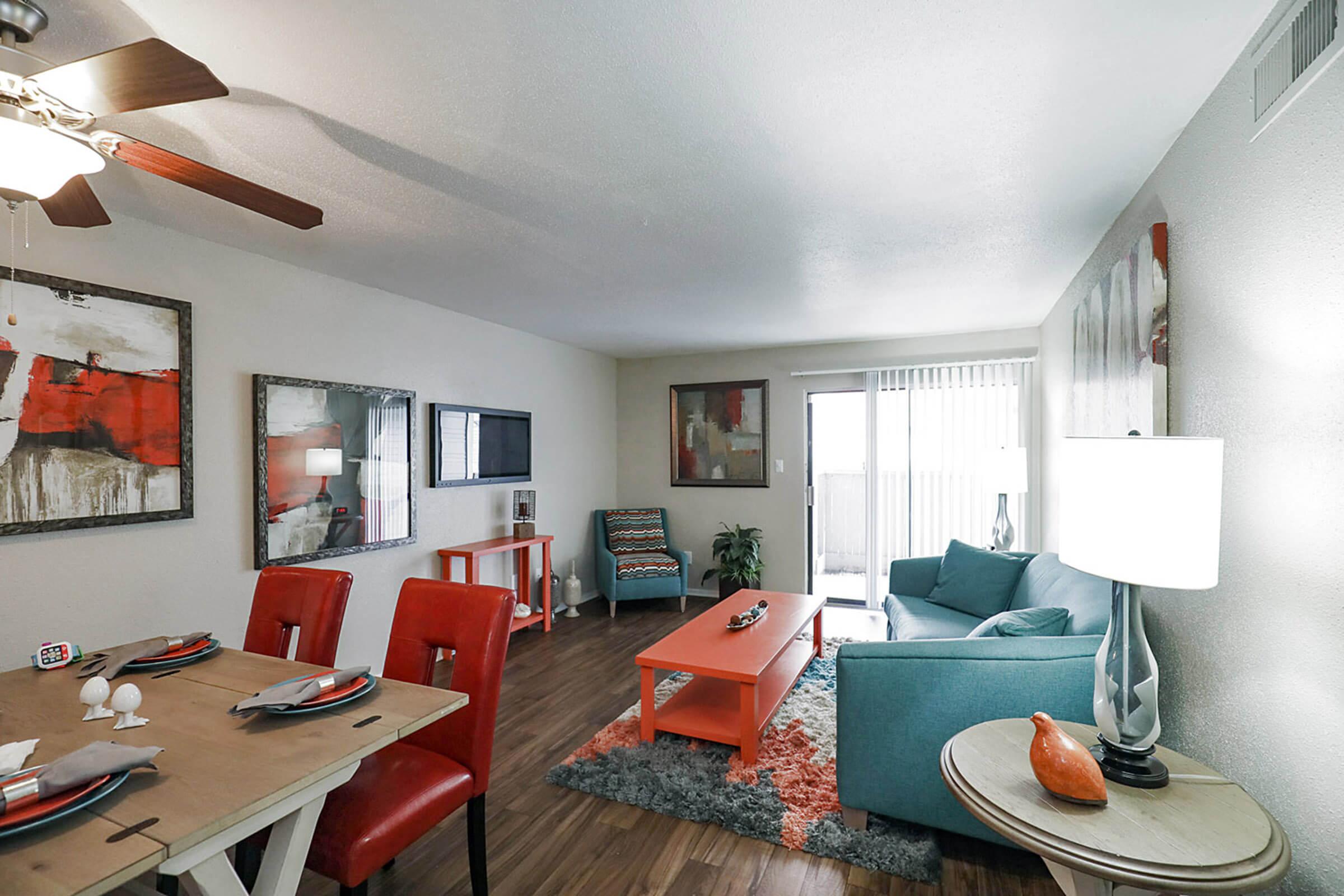 a living room filled with furniture and a flat screen tv
