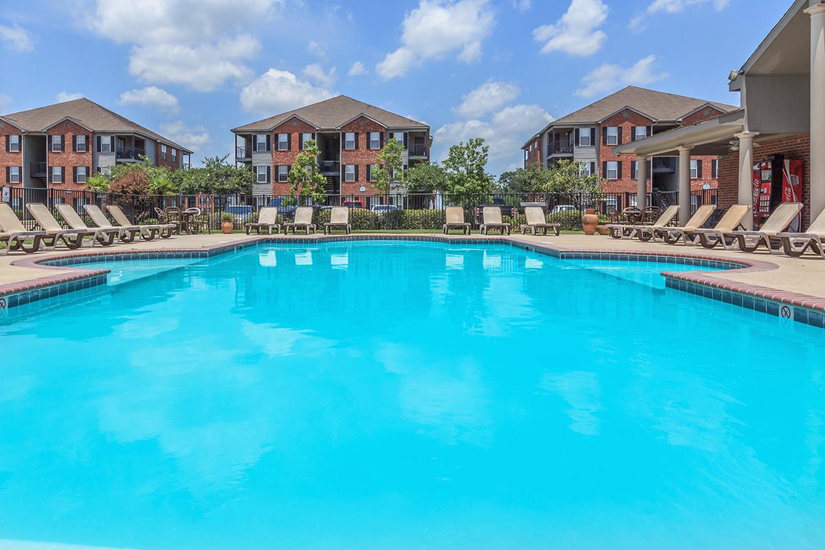 a house with a large pool of water