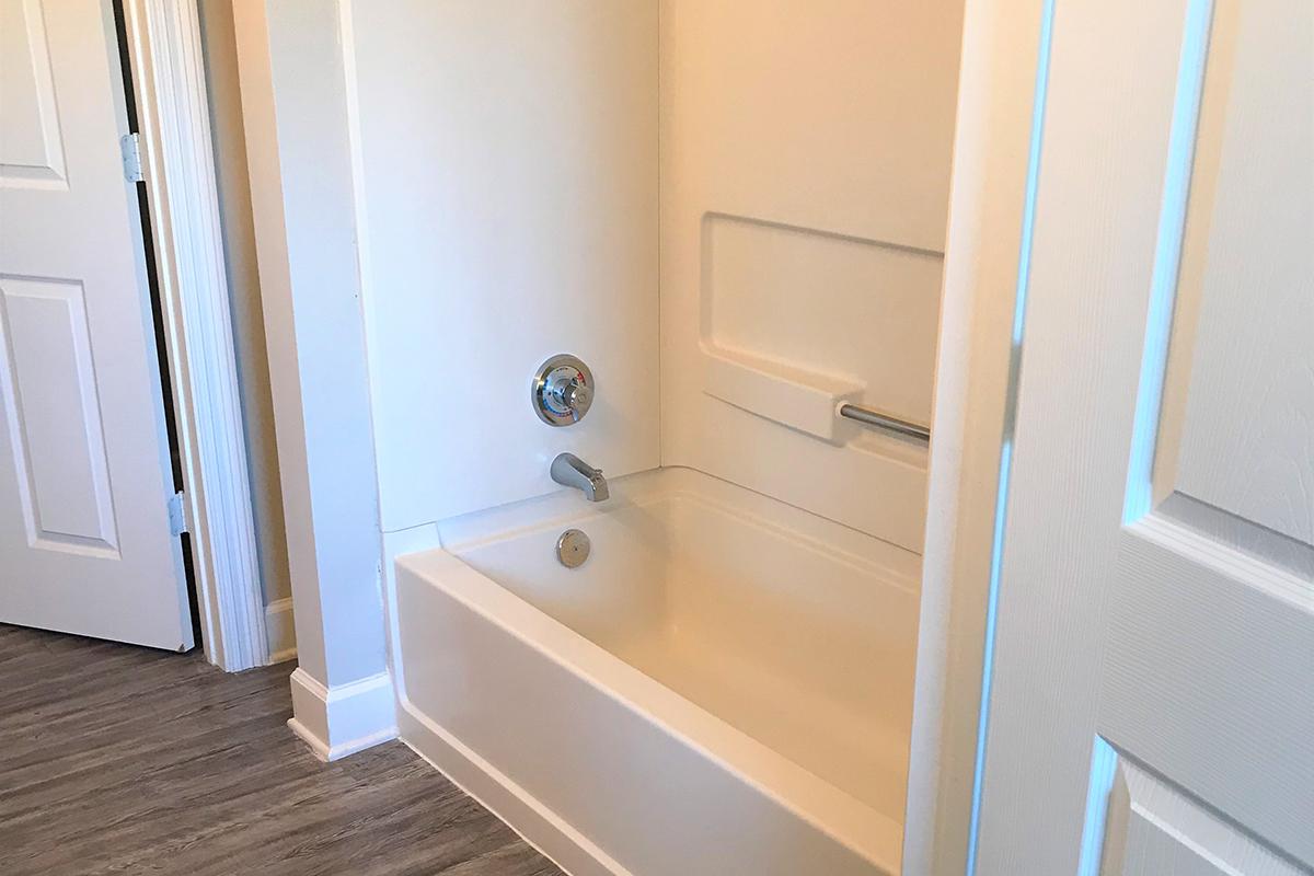 a white sink sitting next to a door