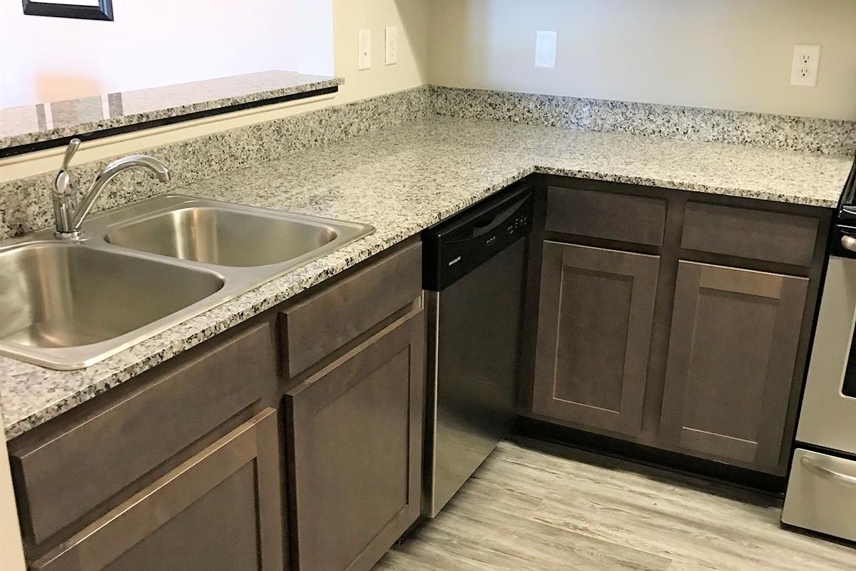 a kitchen with a stove and a sink