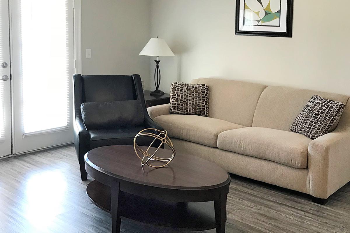 a living room with a leather chair
