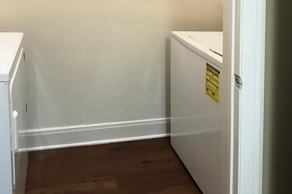 a white refrigerator freezer sitting next to a door