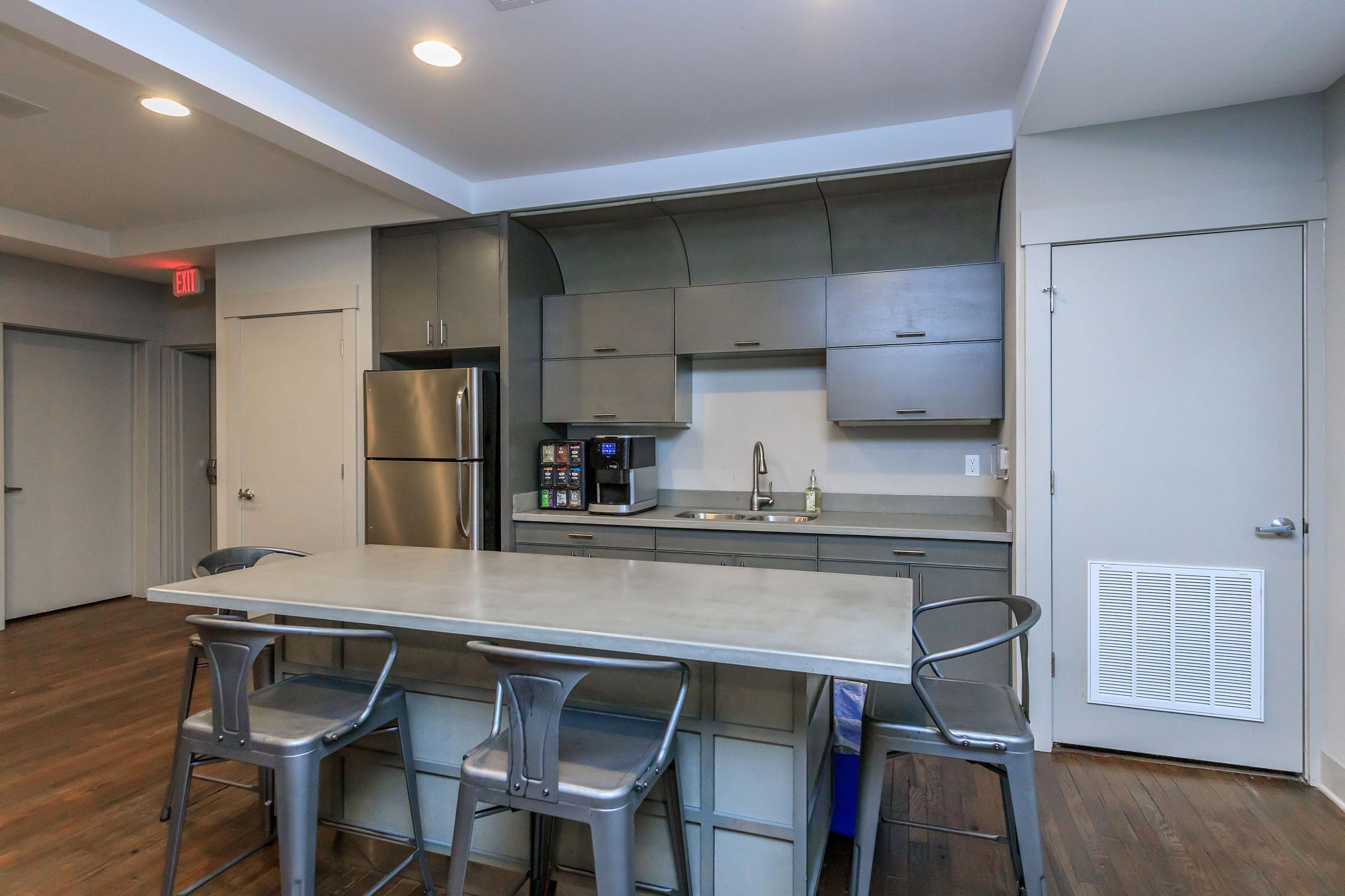 a kitchen with a table in a room