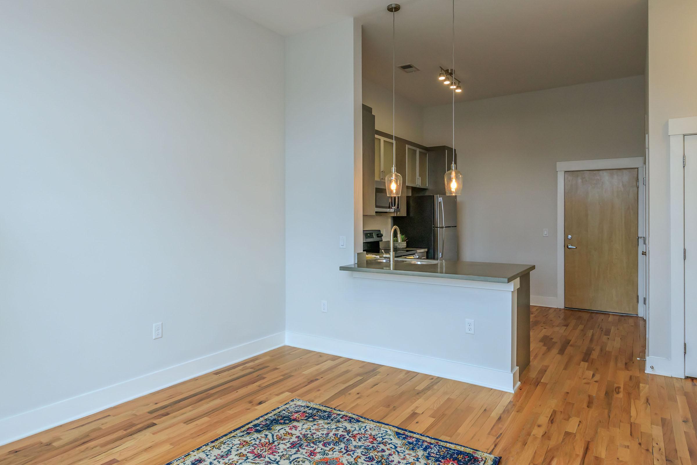 a kitchen with a wood floor