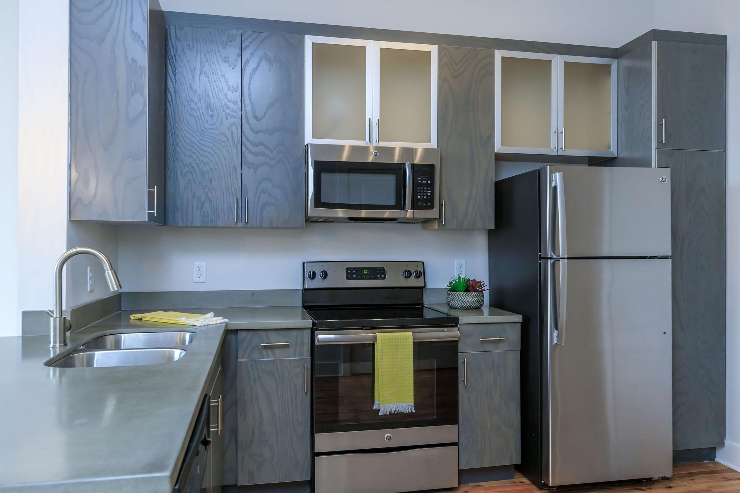 a kitchen with a stove sink and refrigerator