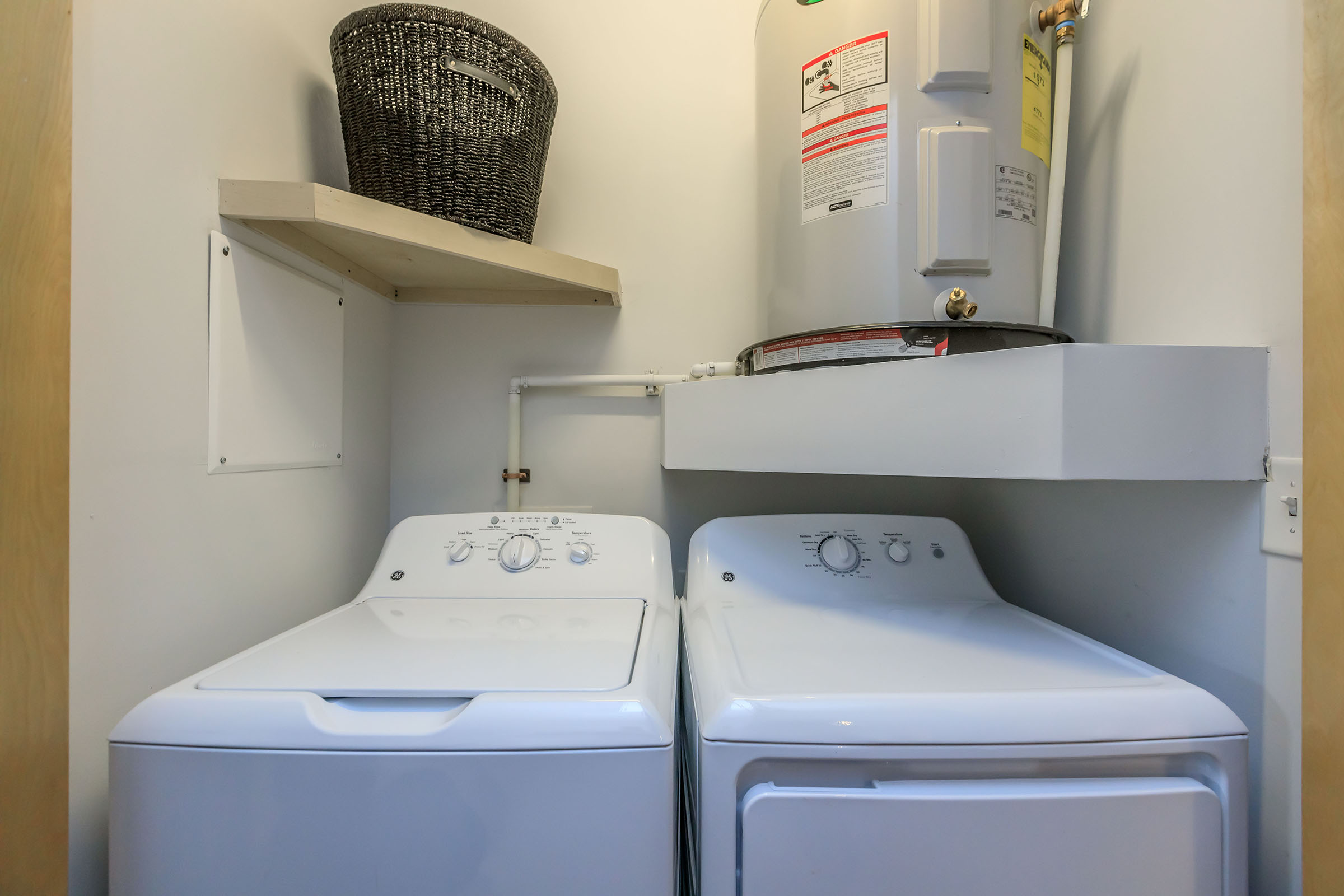 a stove top oven sitting next to a bed