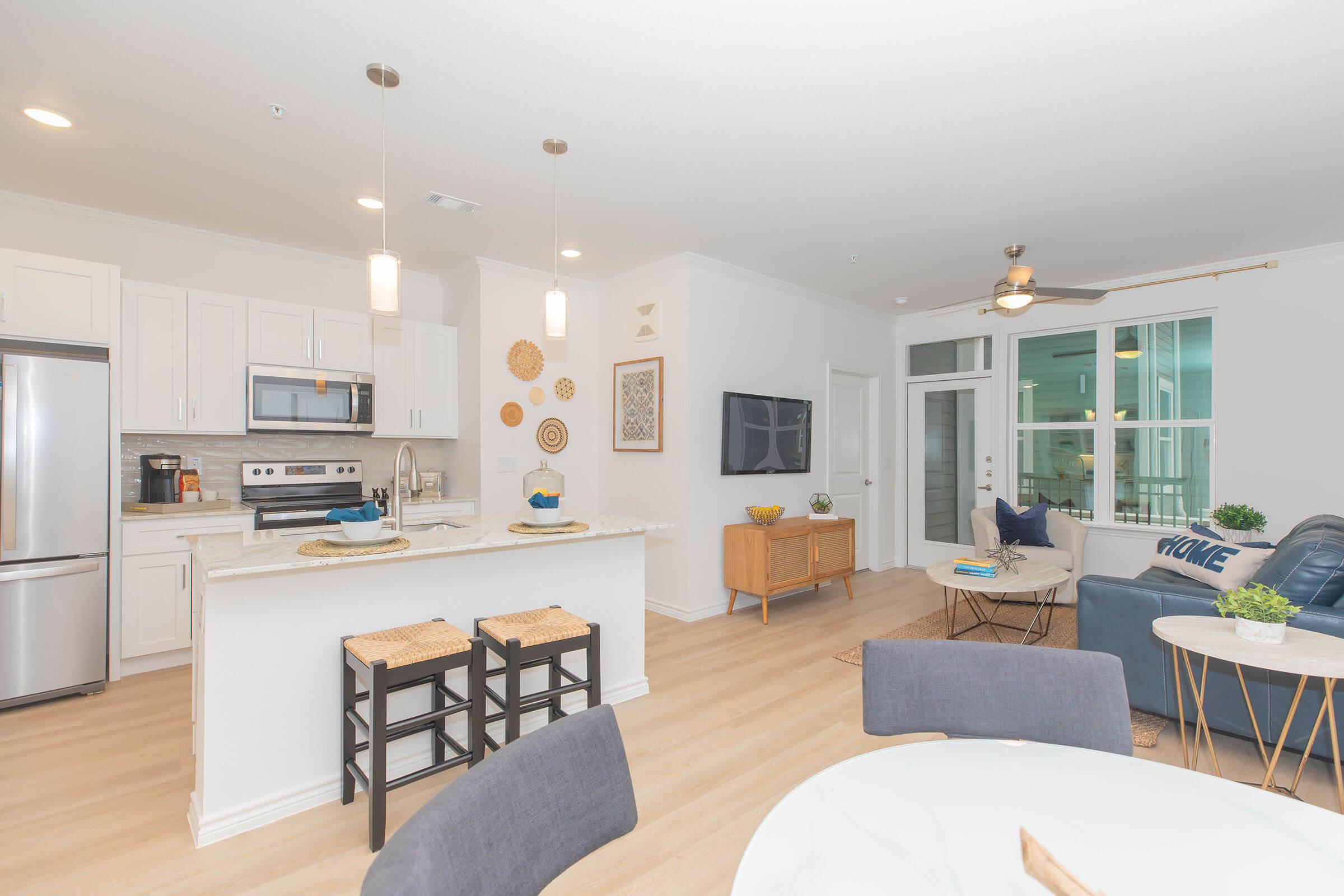 a living room filled with furniture and a table