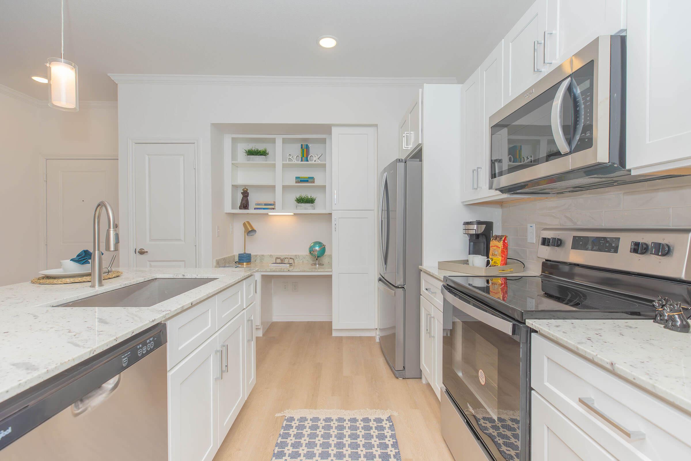 a kitchen with a sink and a microwave