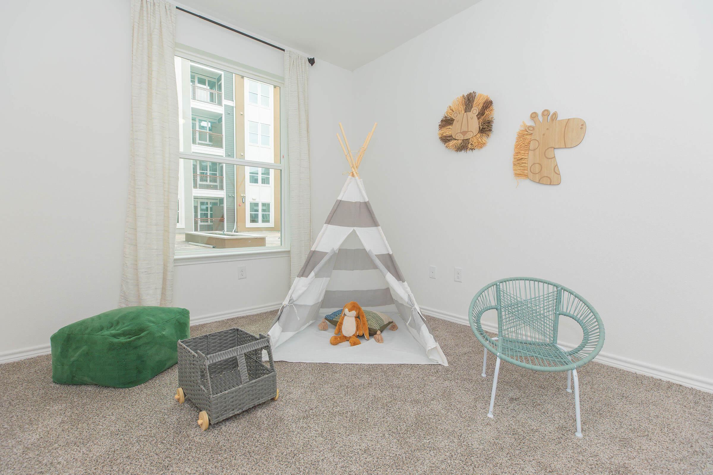 a bedroom with a stuffed animal