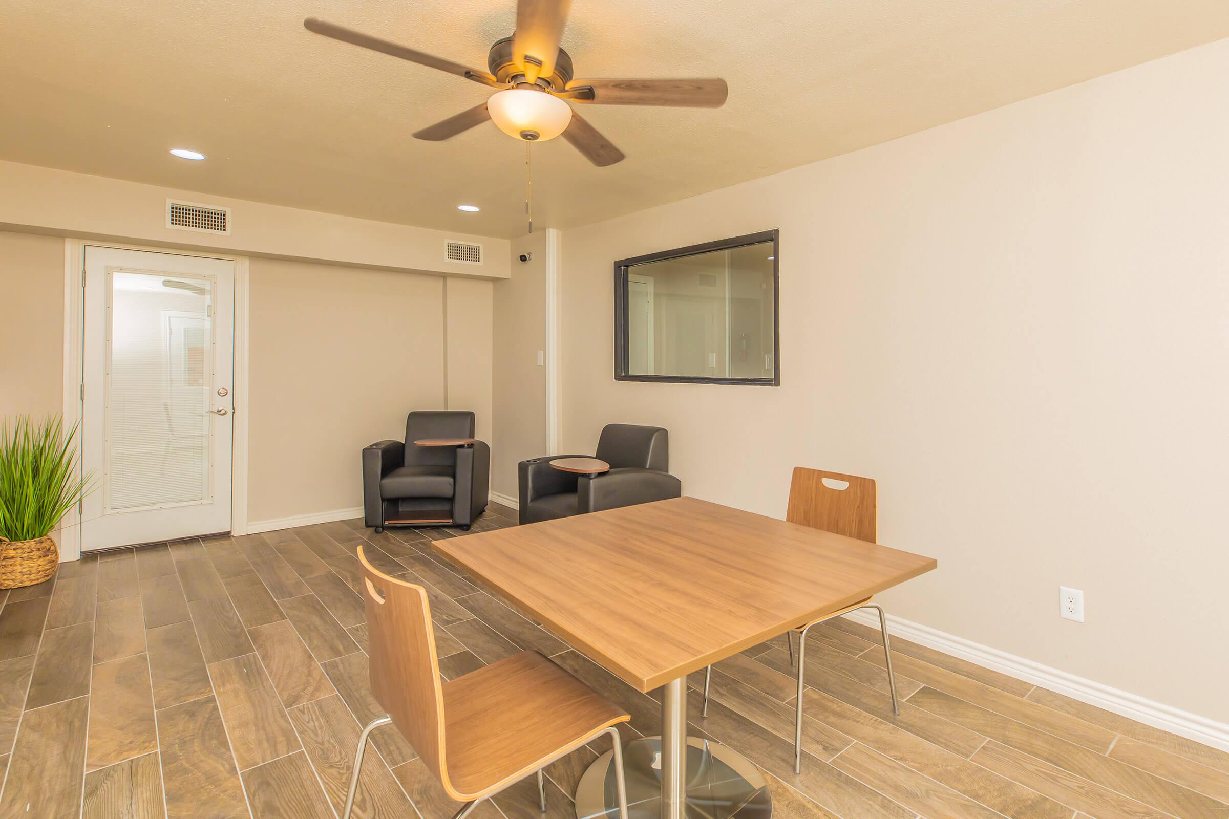 a room with a wooden table