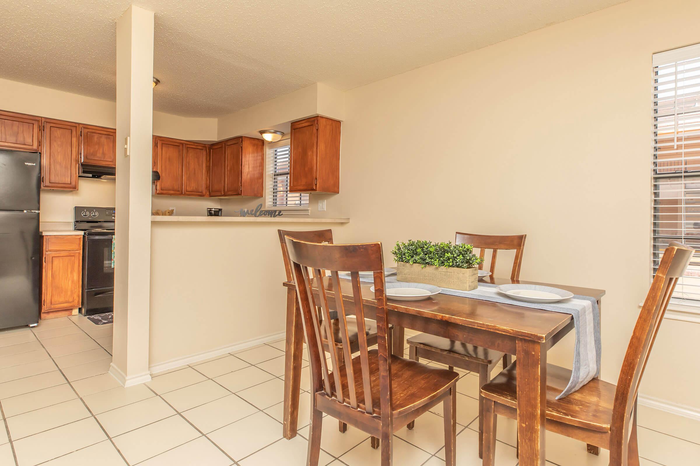 a kitchen with a dining room table